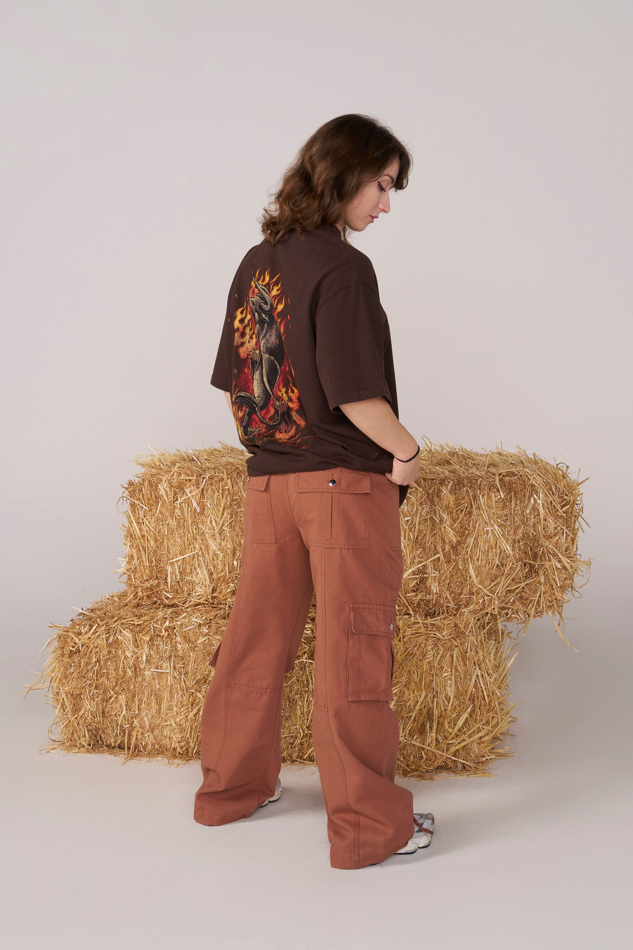 Close-up of waistband adjusters on black cargo pants for streetwear outfits