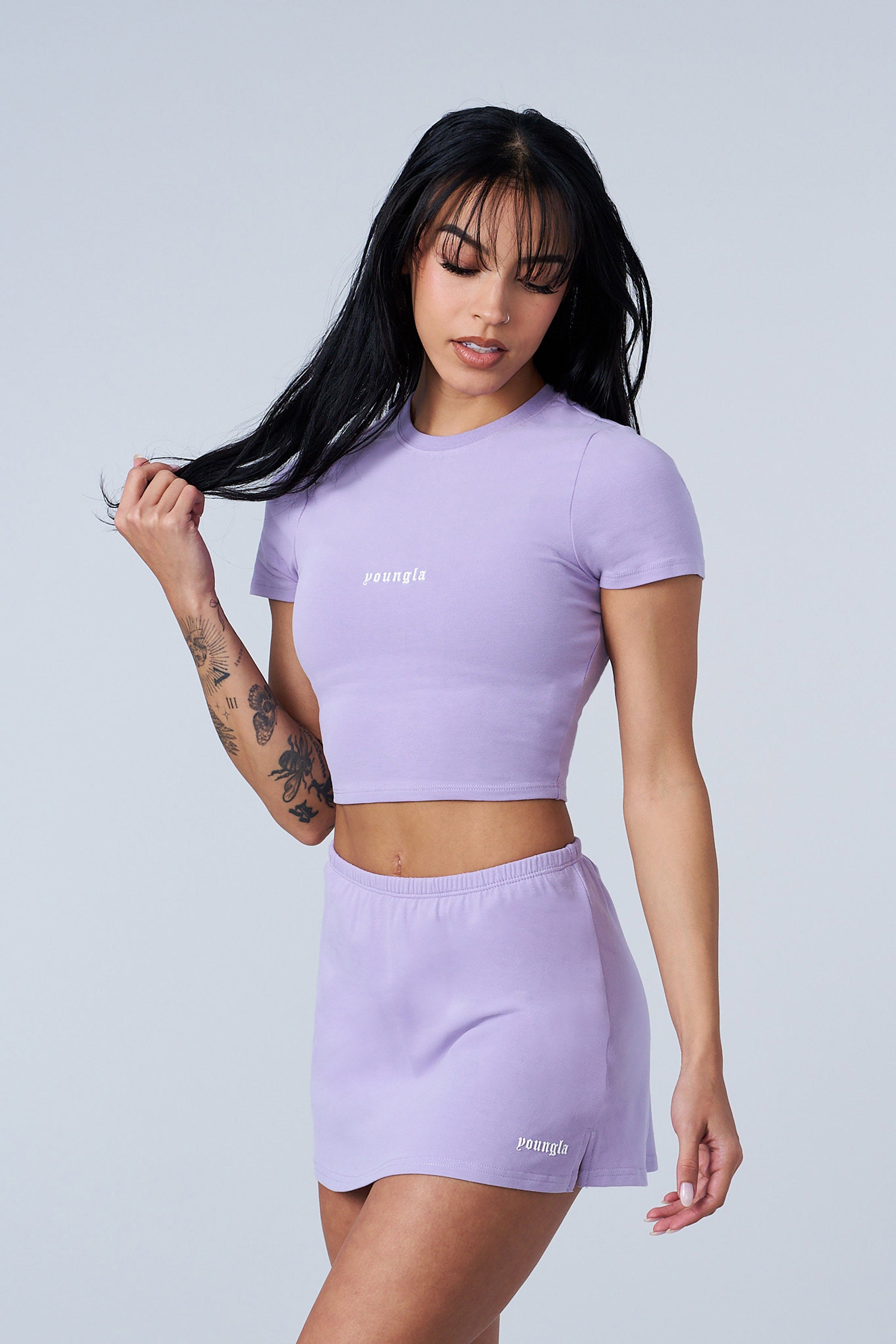 Front view of the chic baby tee, showcasing its soft fabric and fit.