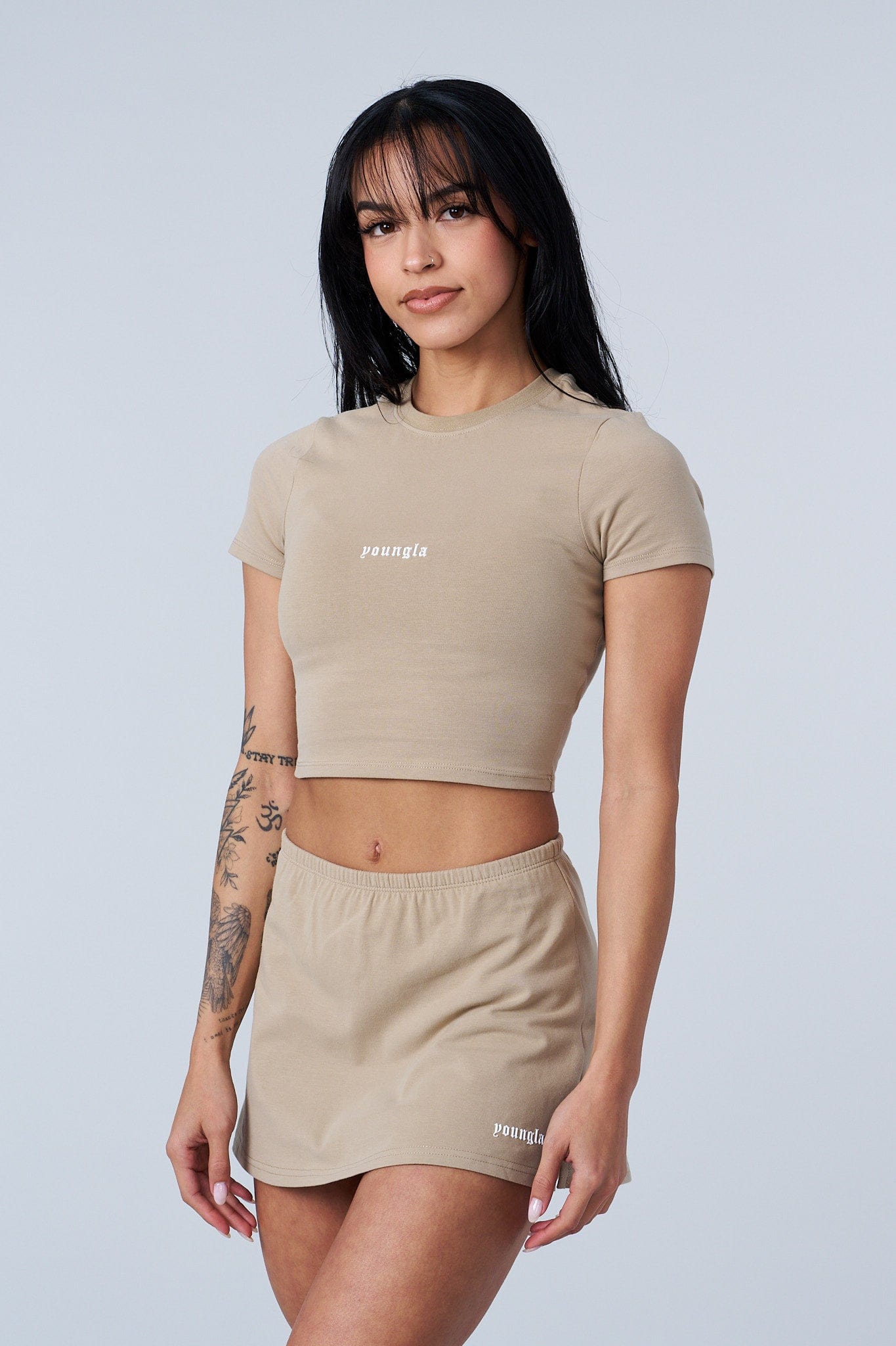 Front view of the chic baby tee, showcasing its soft fabric and fit.