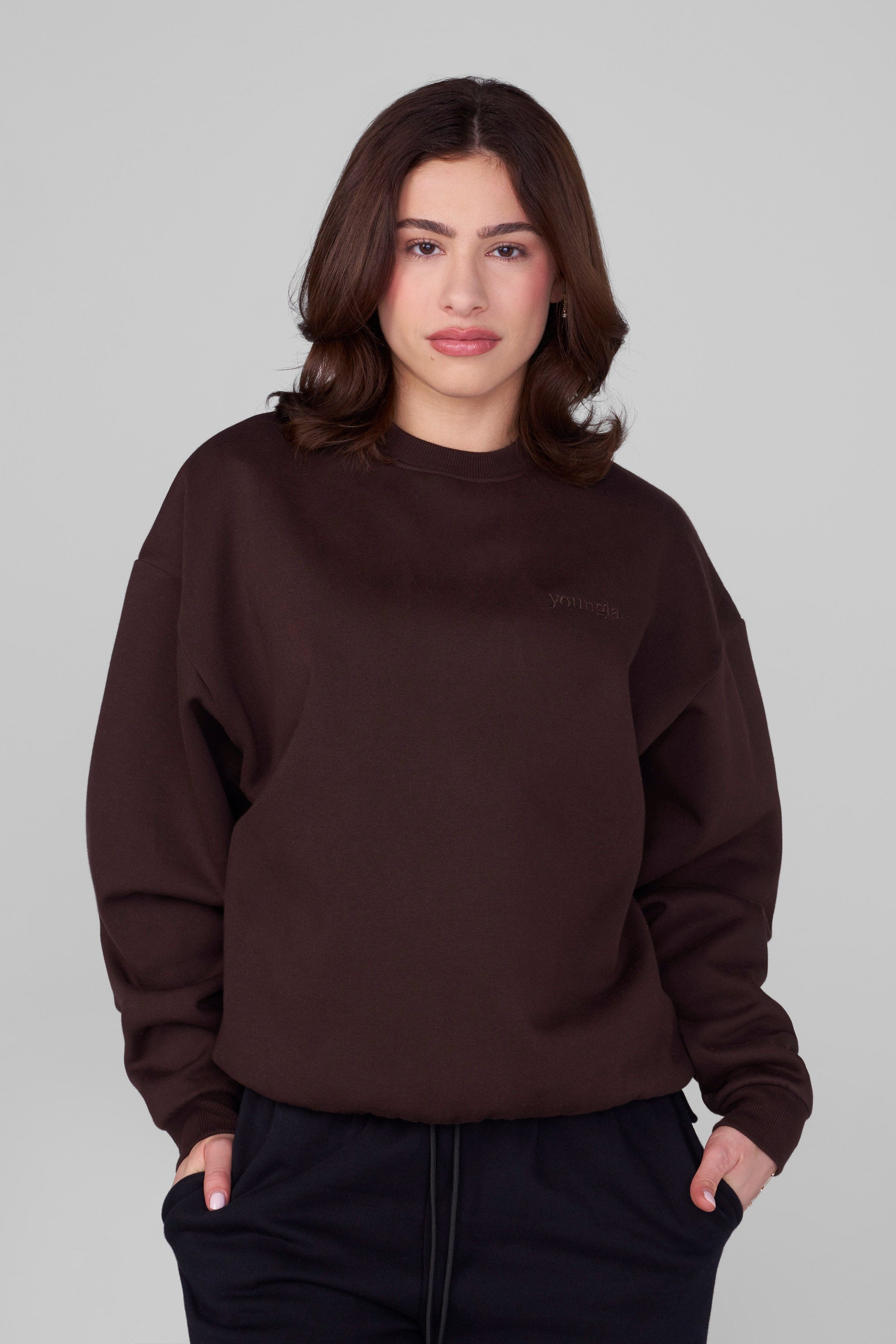 Close-up of marshmallow-textured fleece on oversized crewneck fleece in natural light
