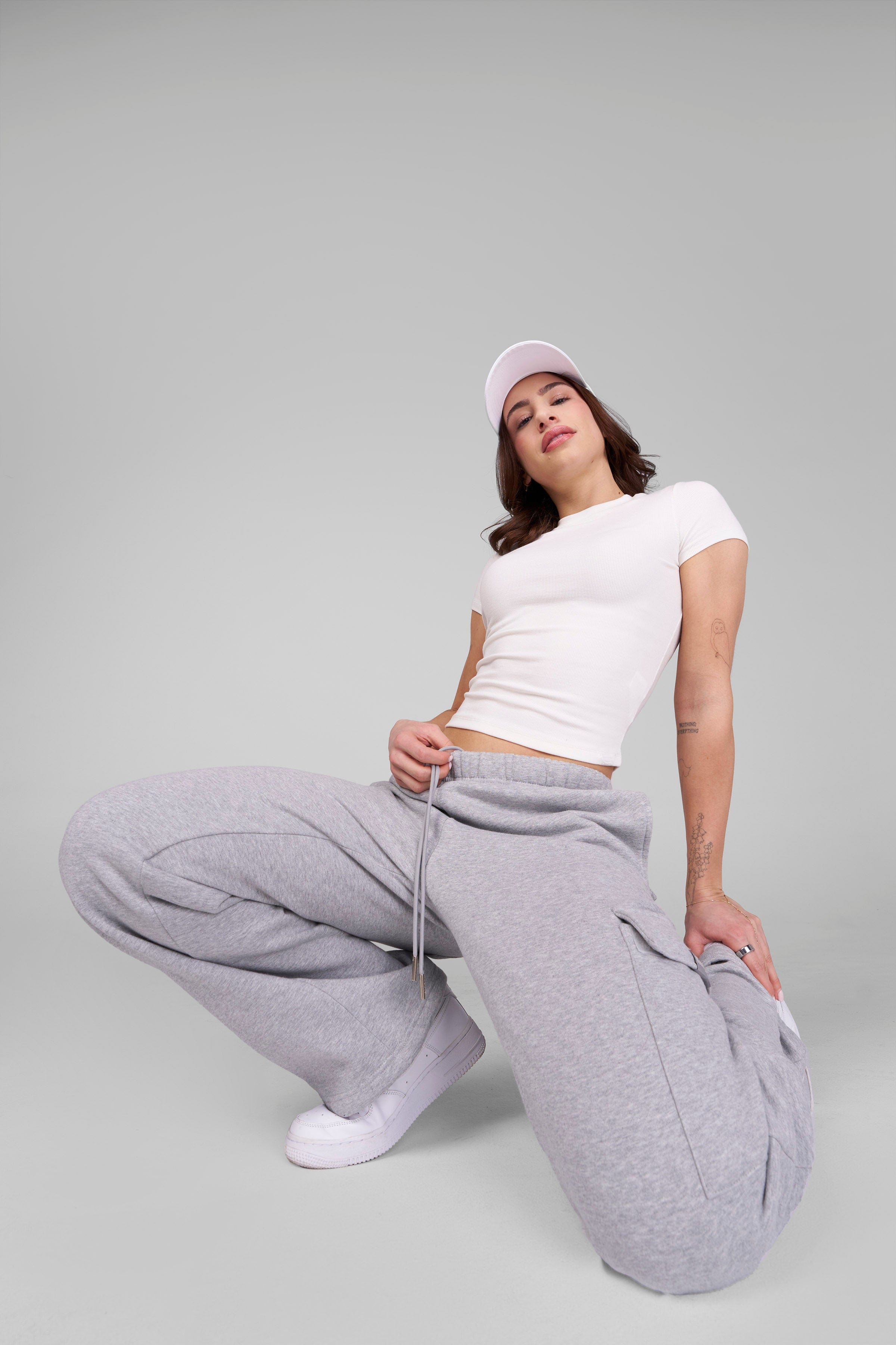 Model wearing the classic baby tee styled with casual jeans for a chic look.