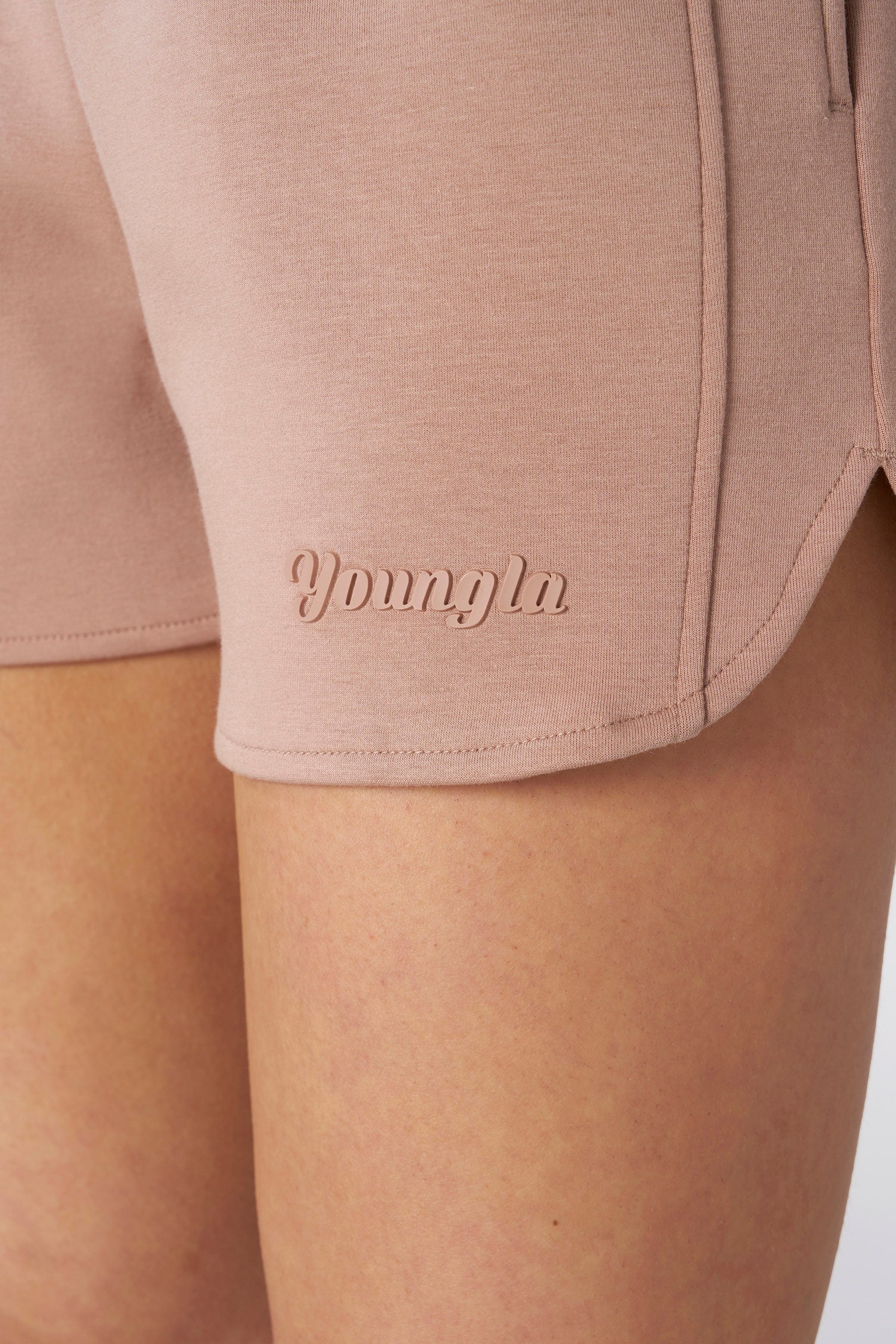 Close-up of fabric texture and waistband of womens scuba shorts