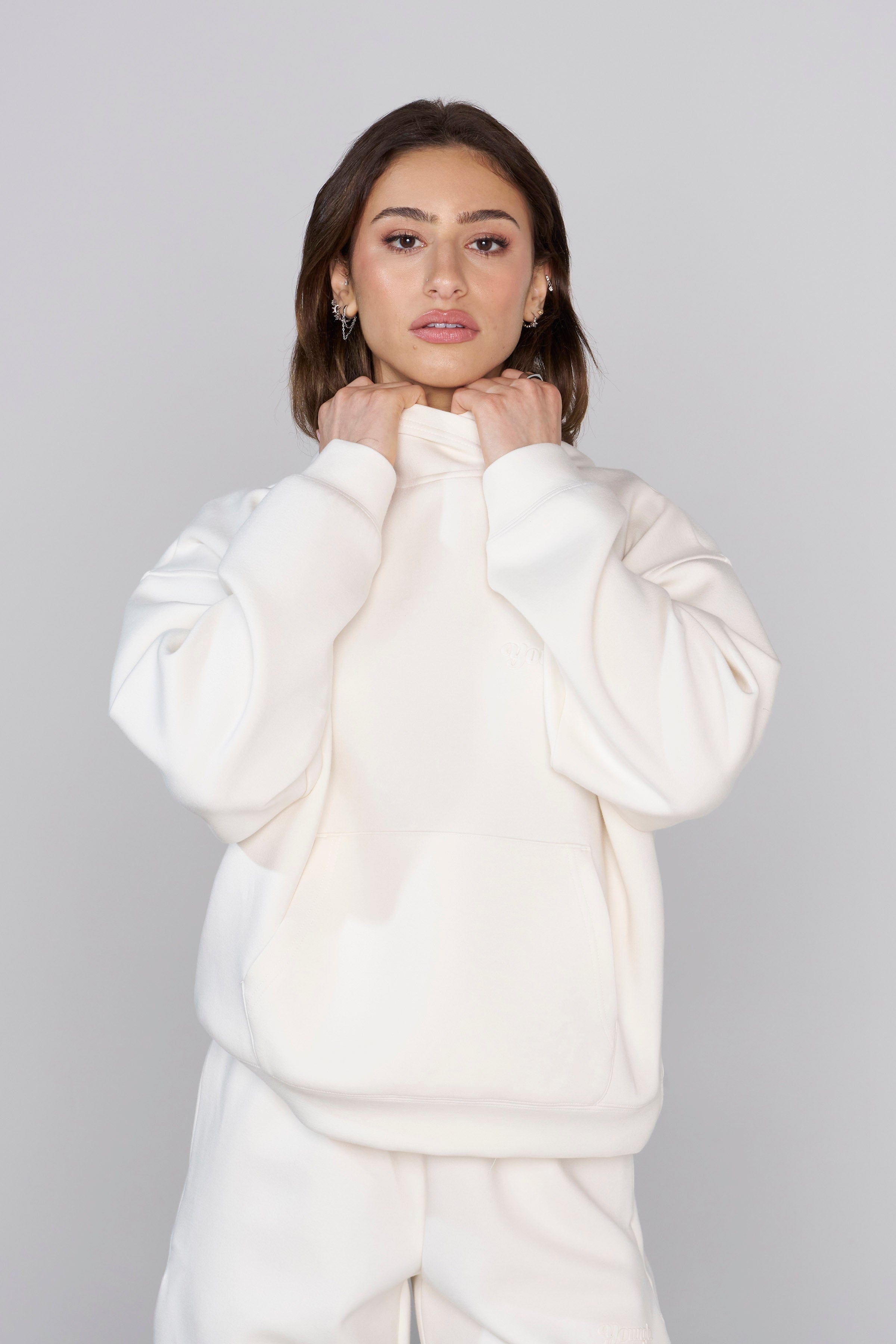 Model wearing the mens Carhartt hoodie, perfect for casual outings.