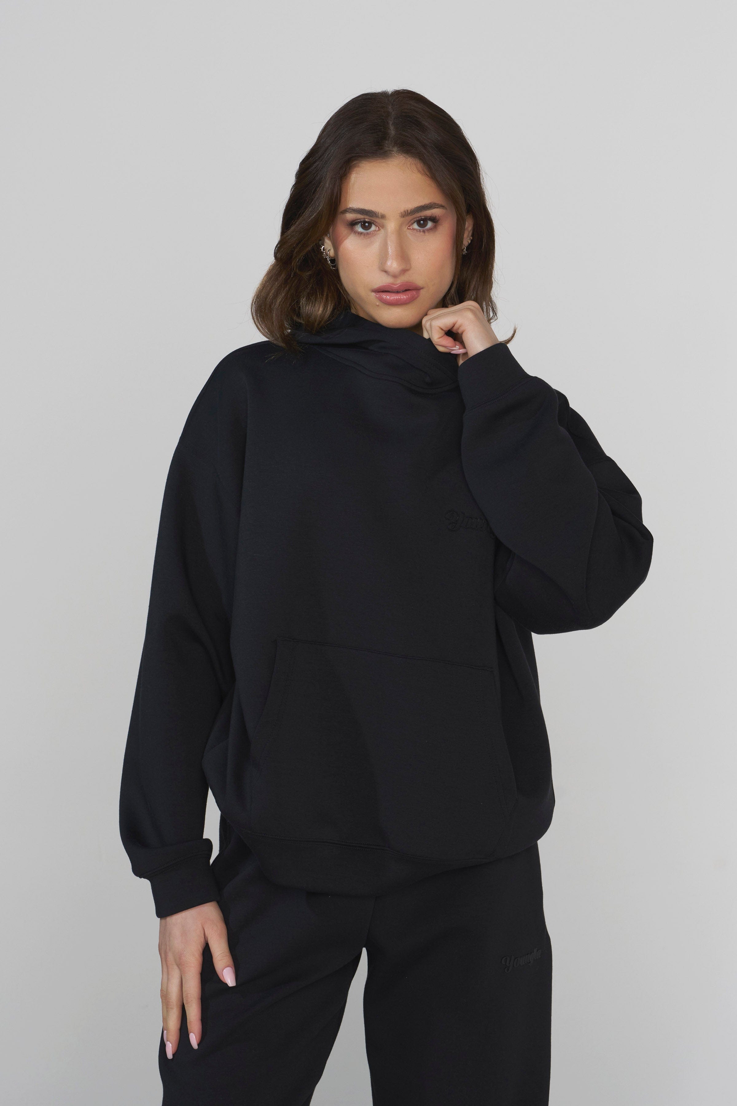Close-up of the debossed logo on the scuba hoodie, highlighting its quality.