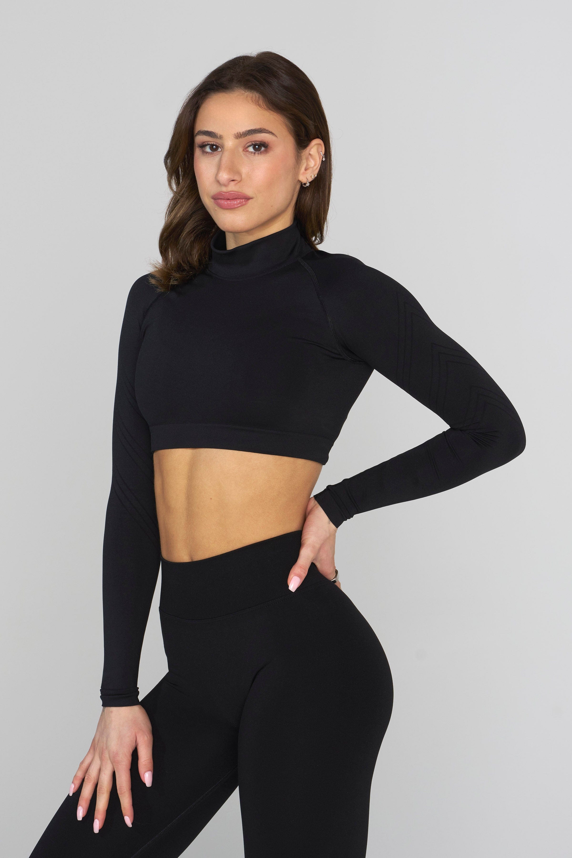 Close-up of muscle-enhancing sleeve detailing on compression shirt.