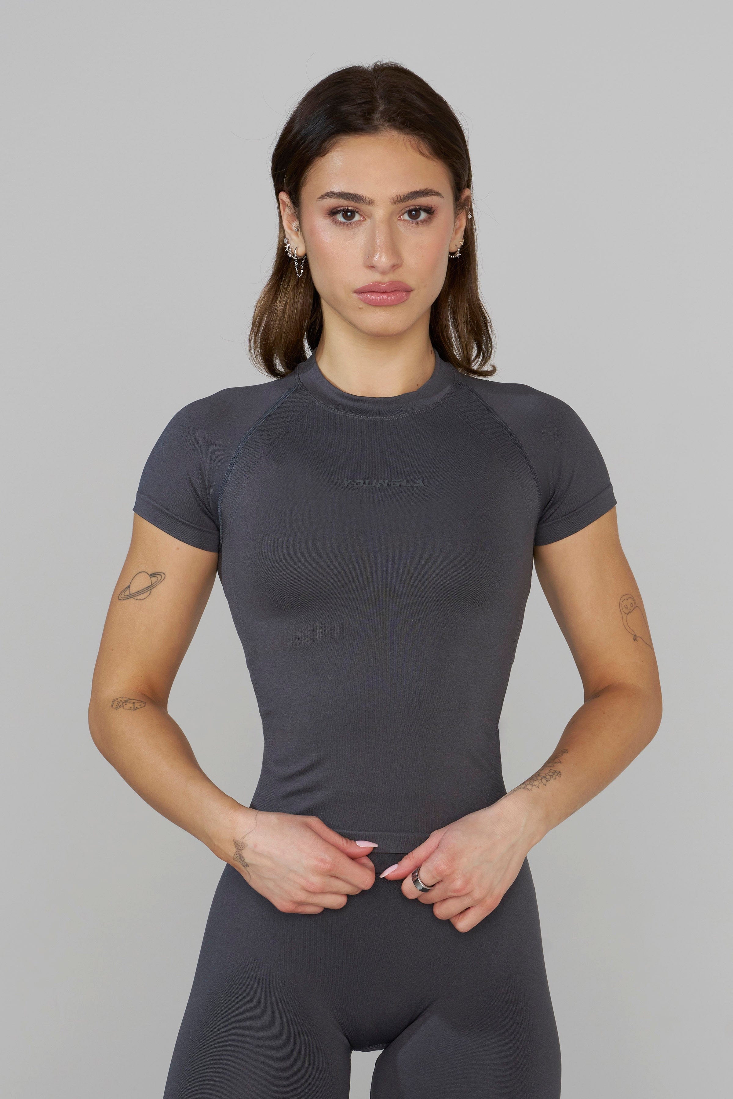 Model wearing the mens workout shirt during an intense training session.