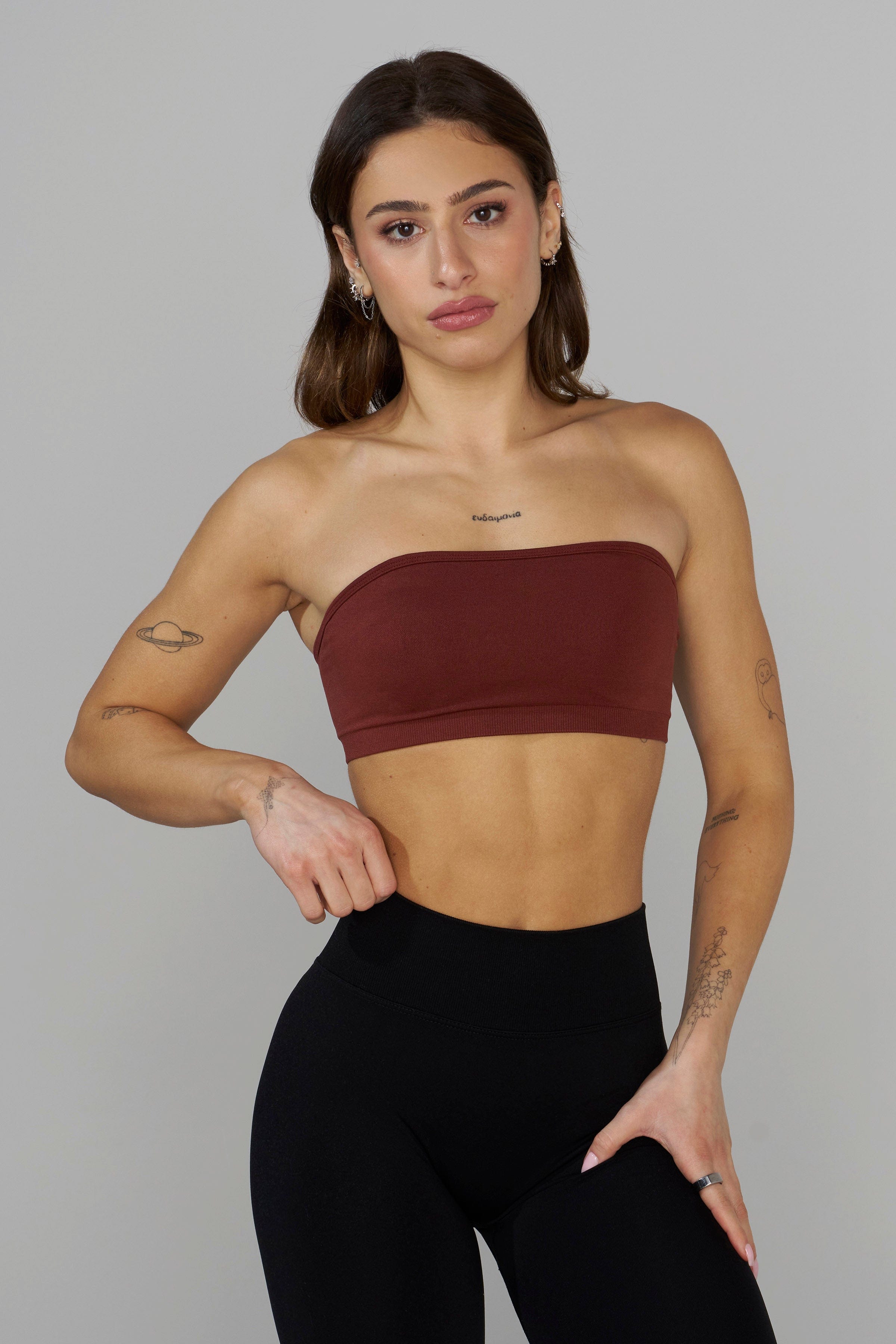 Seamless Curve Bandeau Sports Bra worn by a model during a yoga session.