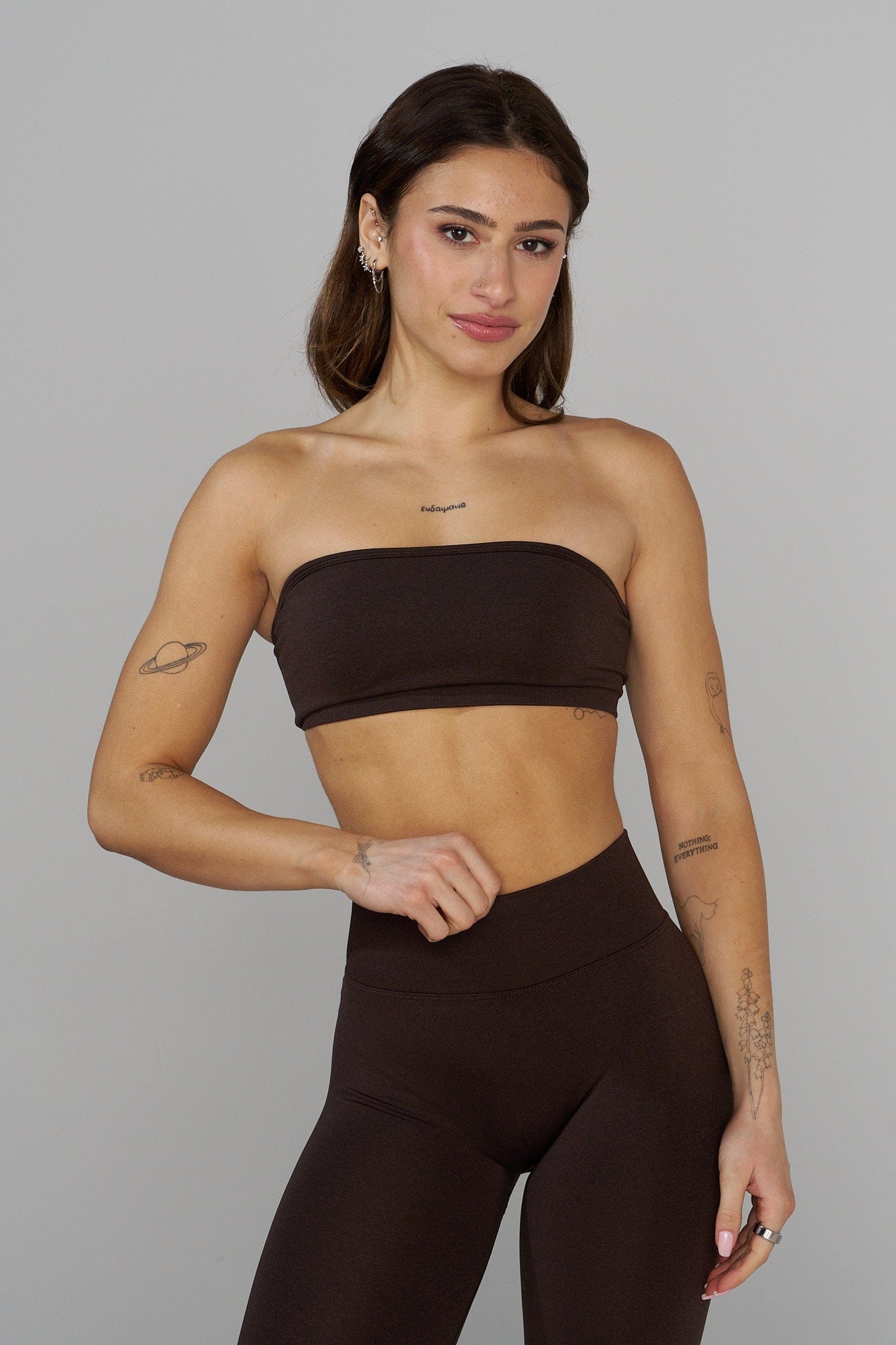 Seamless Curve Bandeau Sports Bra worn by a model during a yoga session.