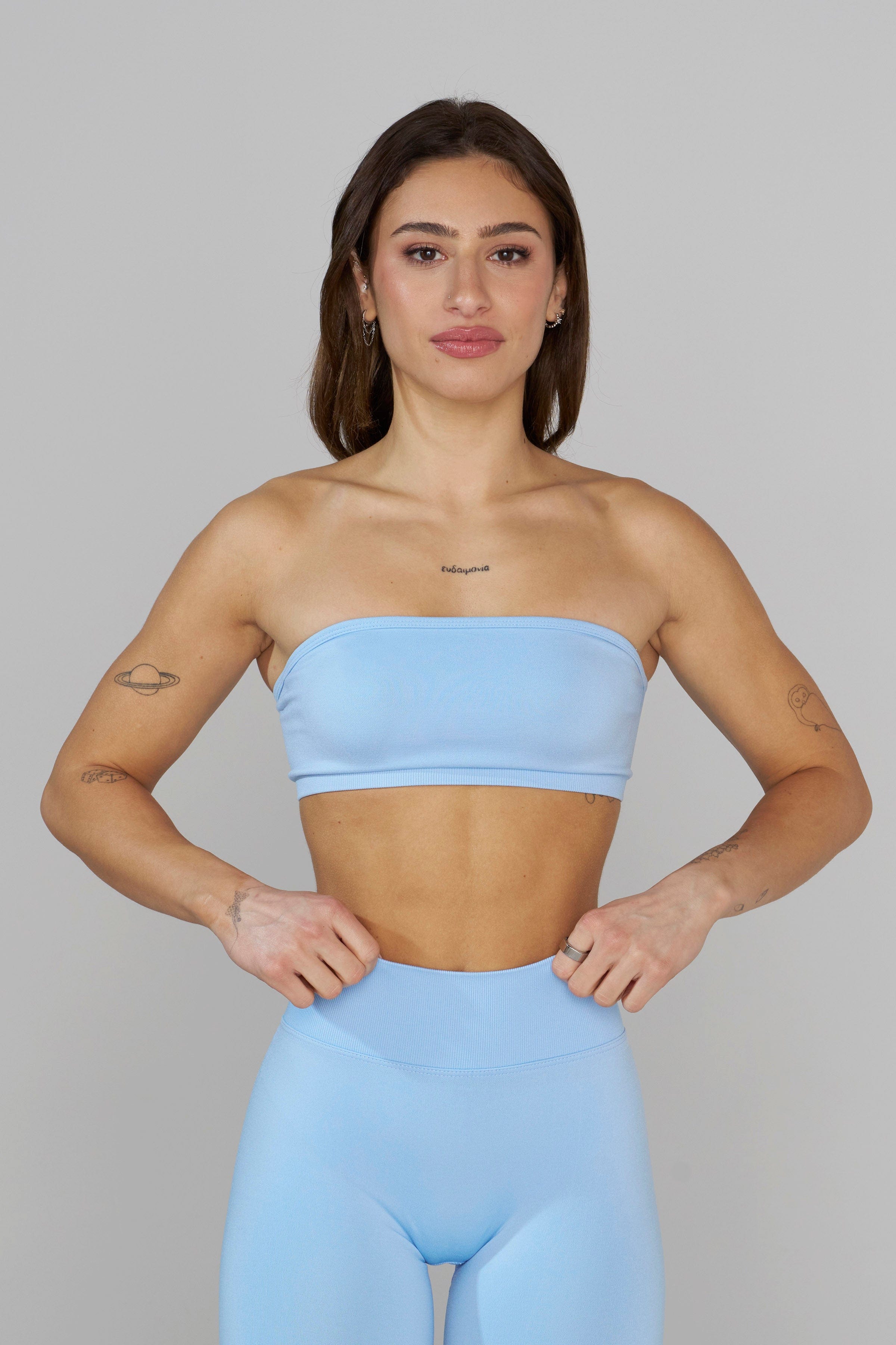 Seamless Curve Bandeau Sports Bra worn by a model during a yoga session.