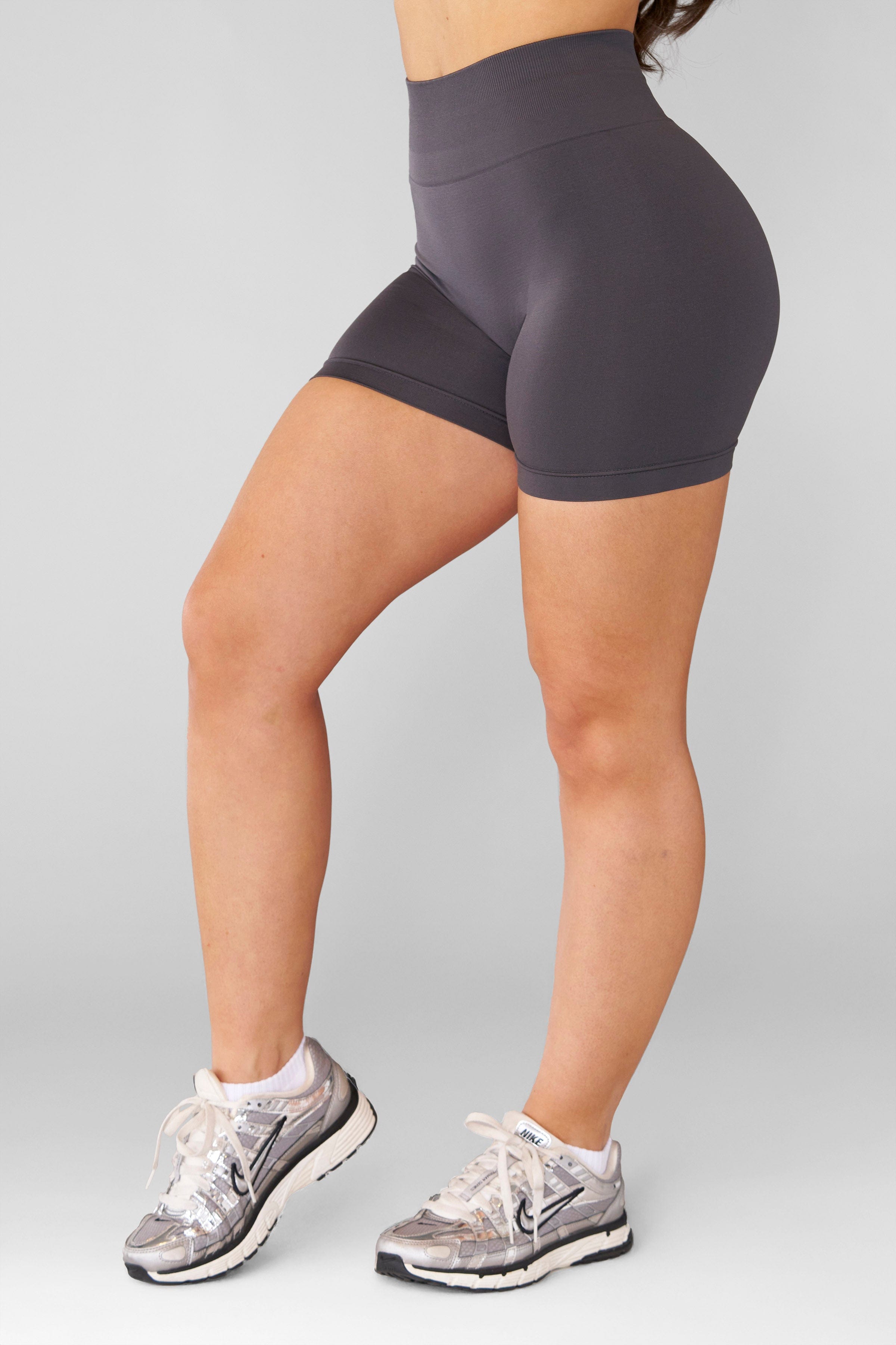 Back view highlighting the fit of the Core Luxe High-Waisted Gym Shorts.