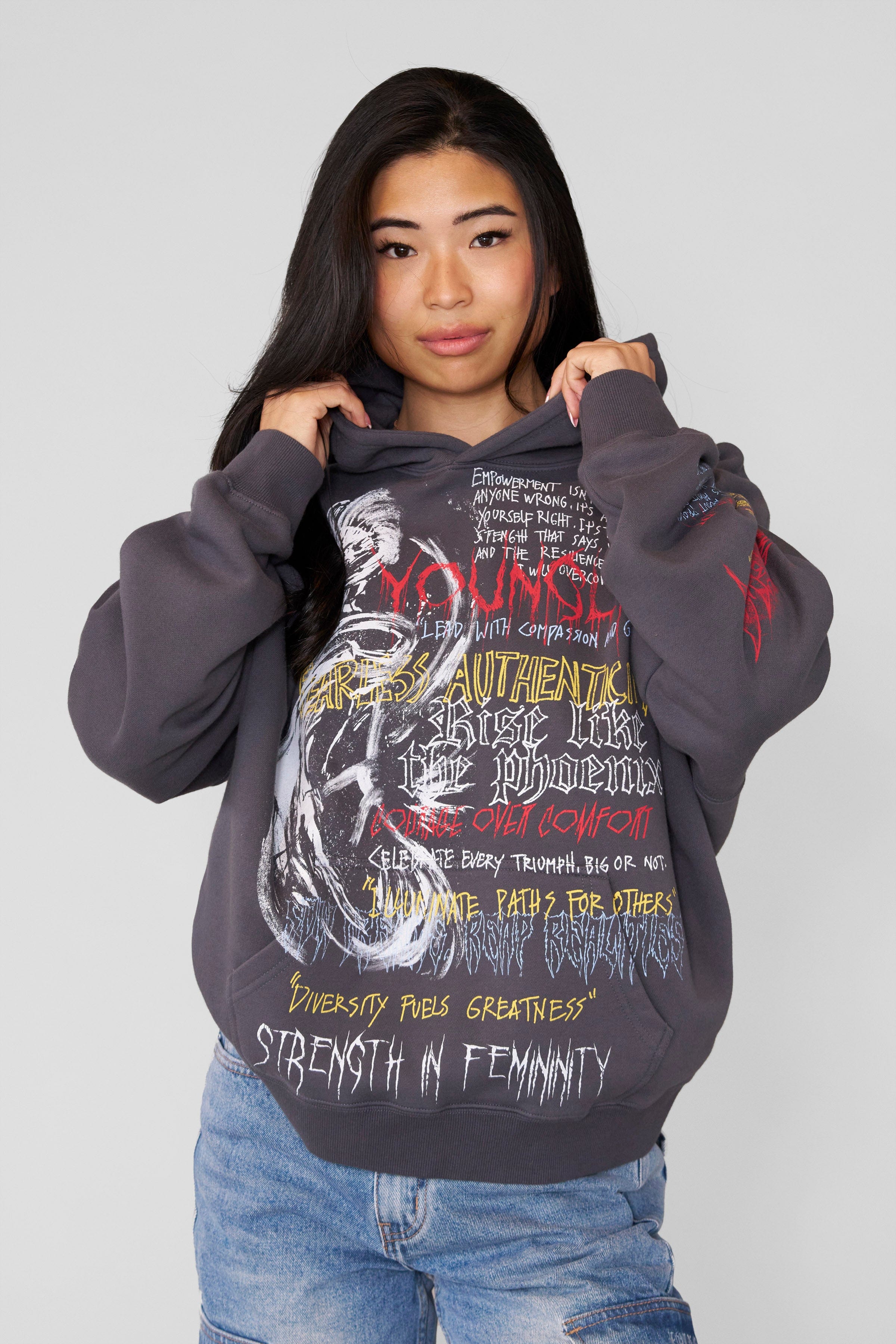 Comfortable hoodie styled with sneakers, coffee mug in hand on outdoor patio