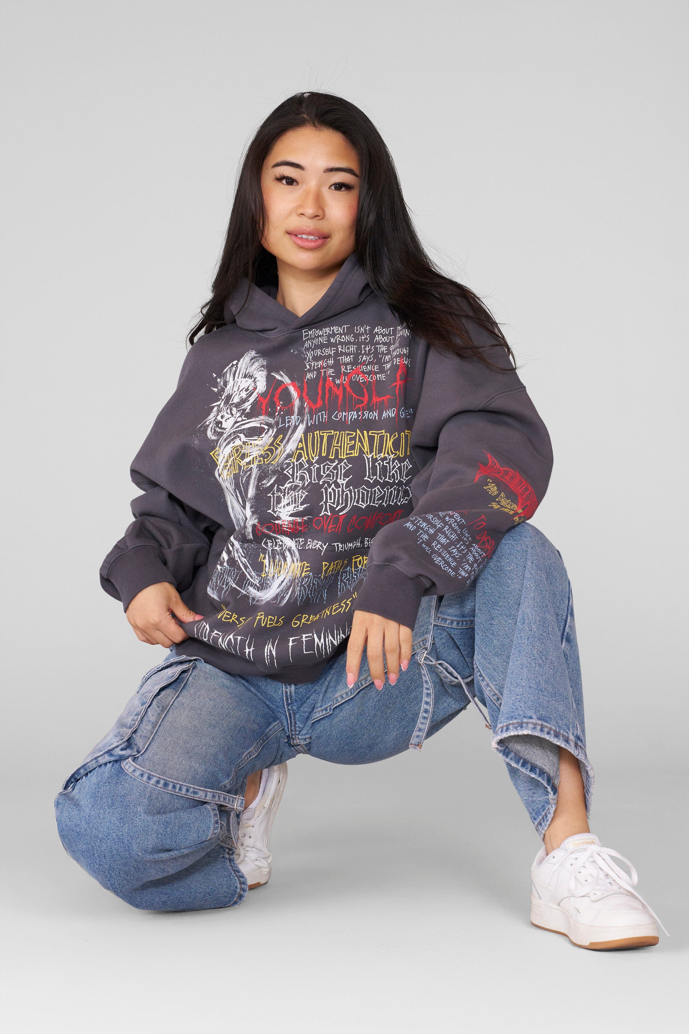 Oversized hoodie men’s fit shown lounging indoors with book and blanket