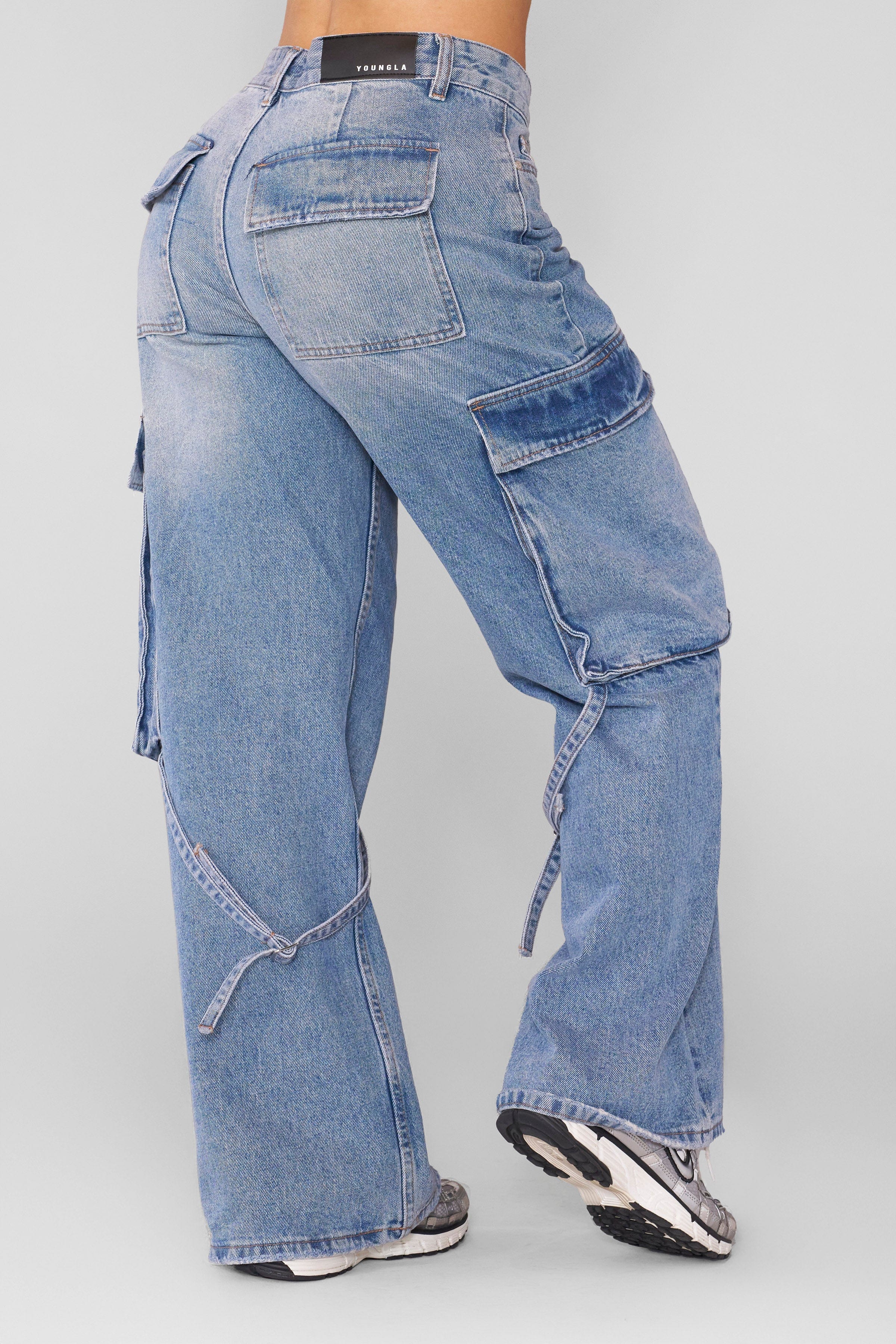 Close-up of high waisted straight leg jeans fabric texture and waistband stitch.