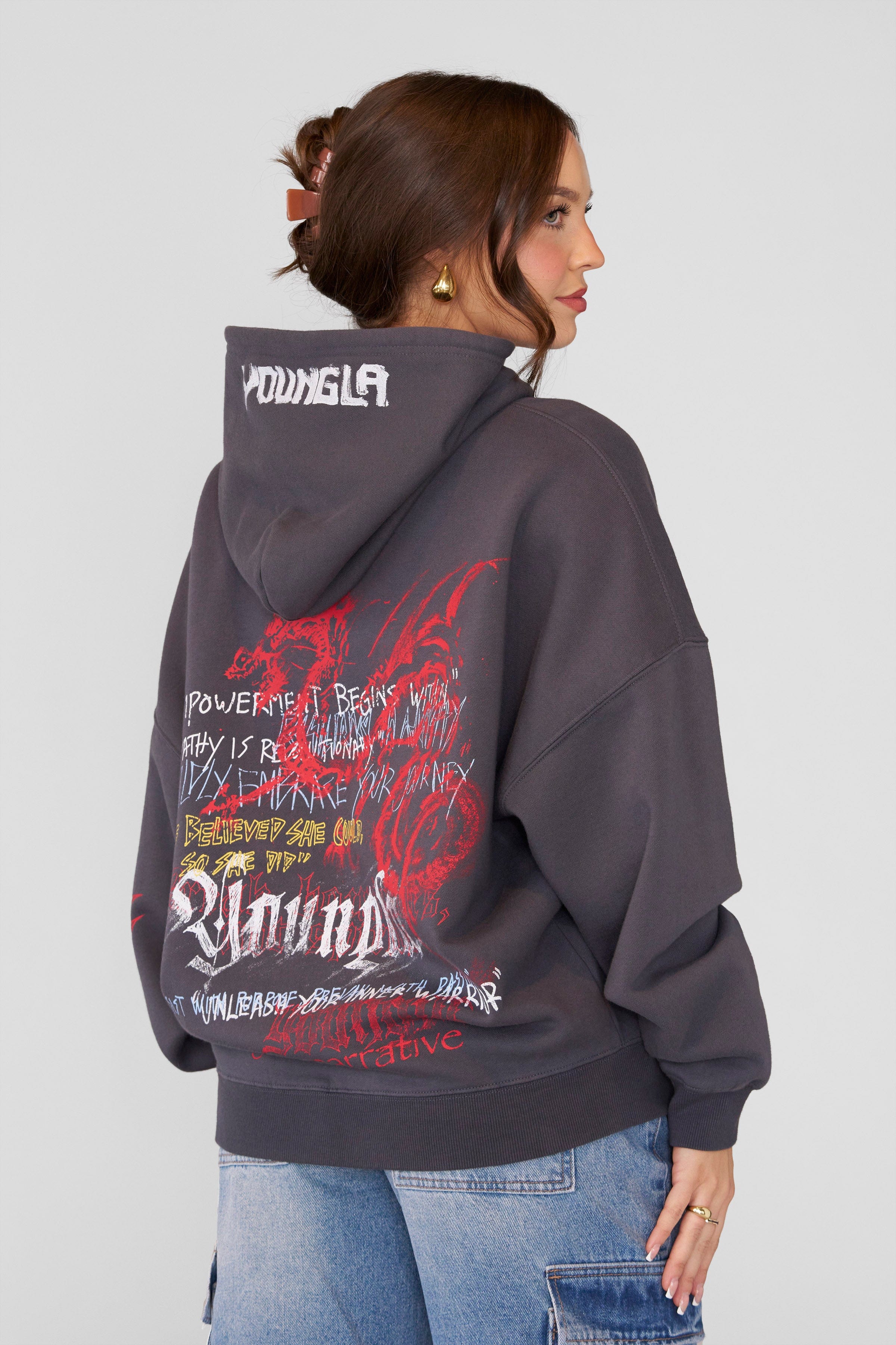 Oversized hoodie men’s fit shown lounging indoors with book and blanket