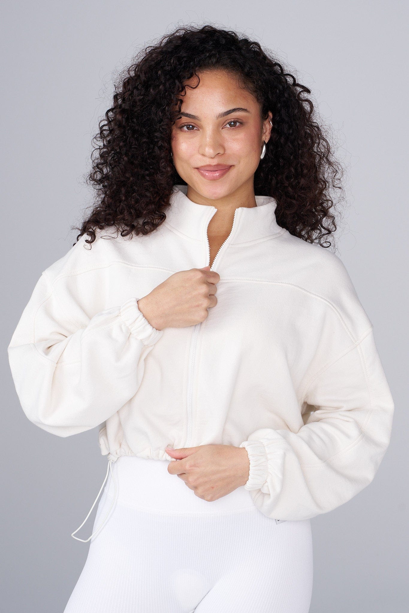 Front view of the Breeze Zip-Up, styled effortlessly for daily wear