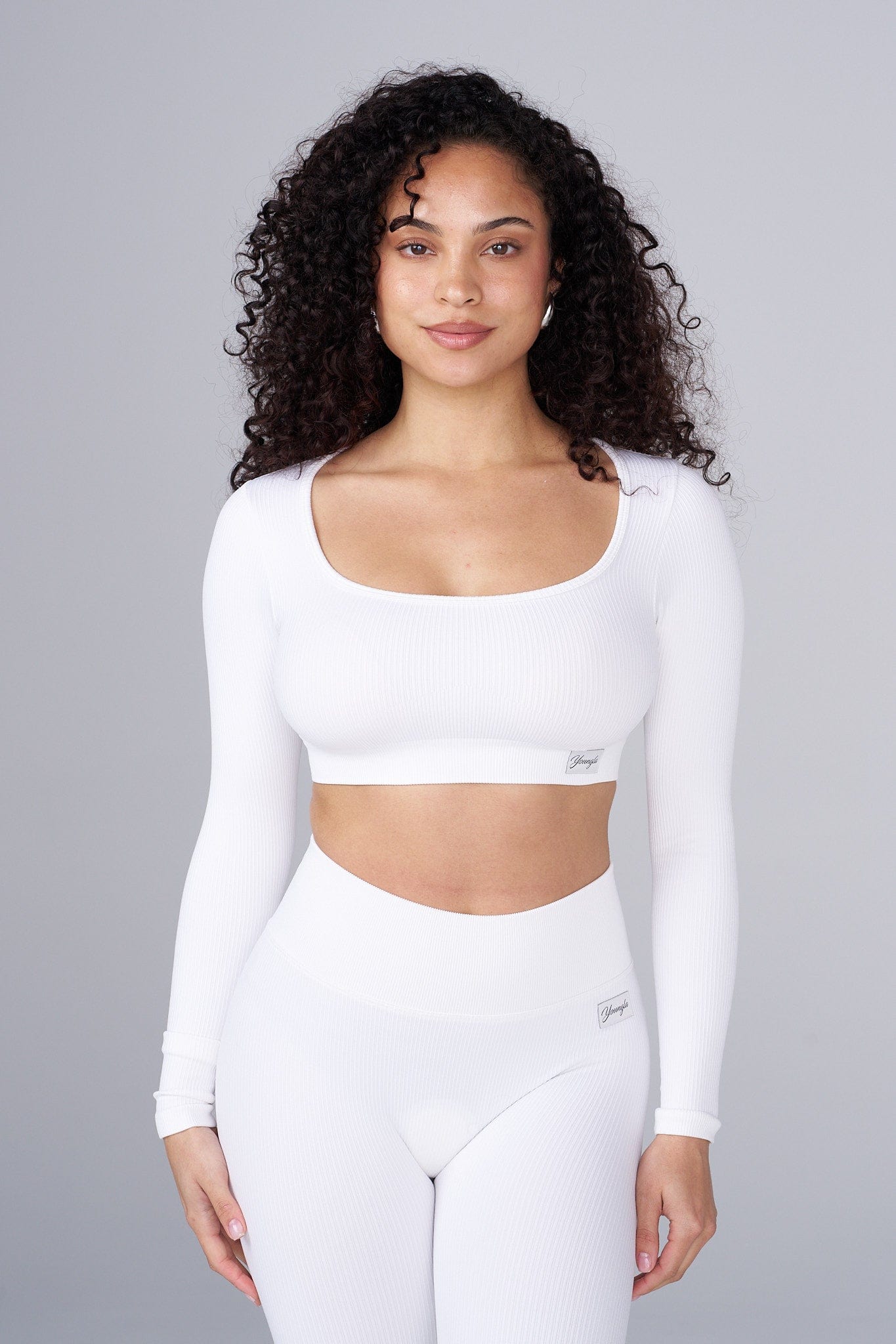 Detail of square neckline on womens tops, ideal for layering.