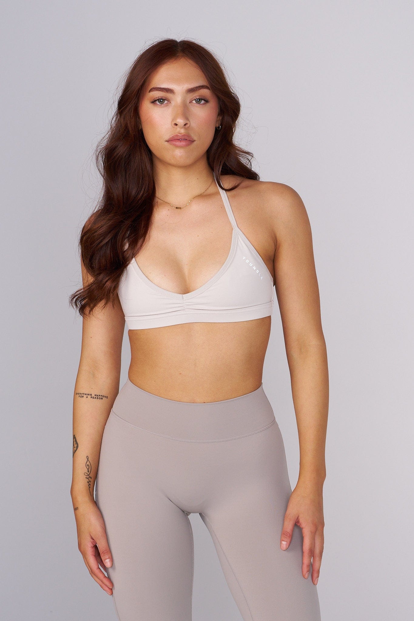 Backless design of the Urban V-Neck workout bra during exercise.