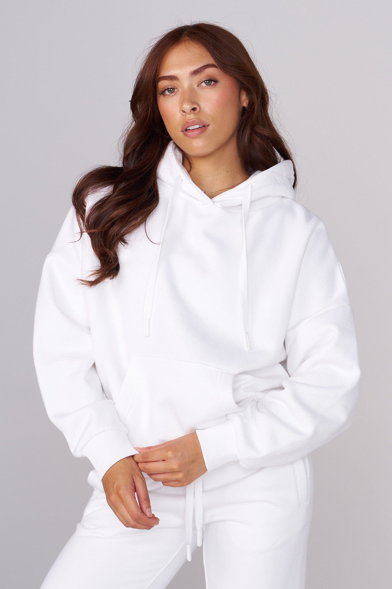 Model wearing the oversized zip up hoodie in a casual setting.