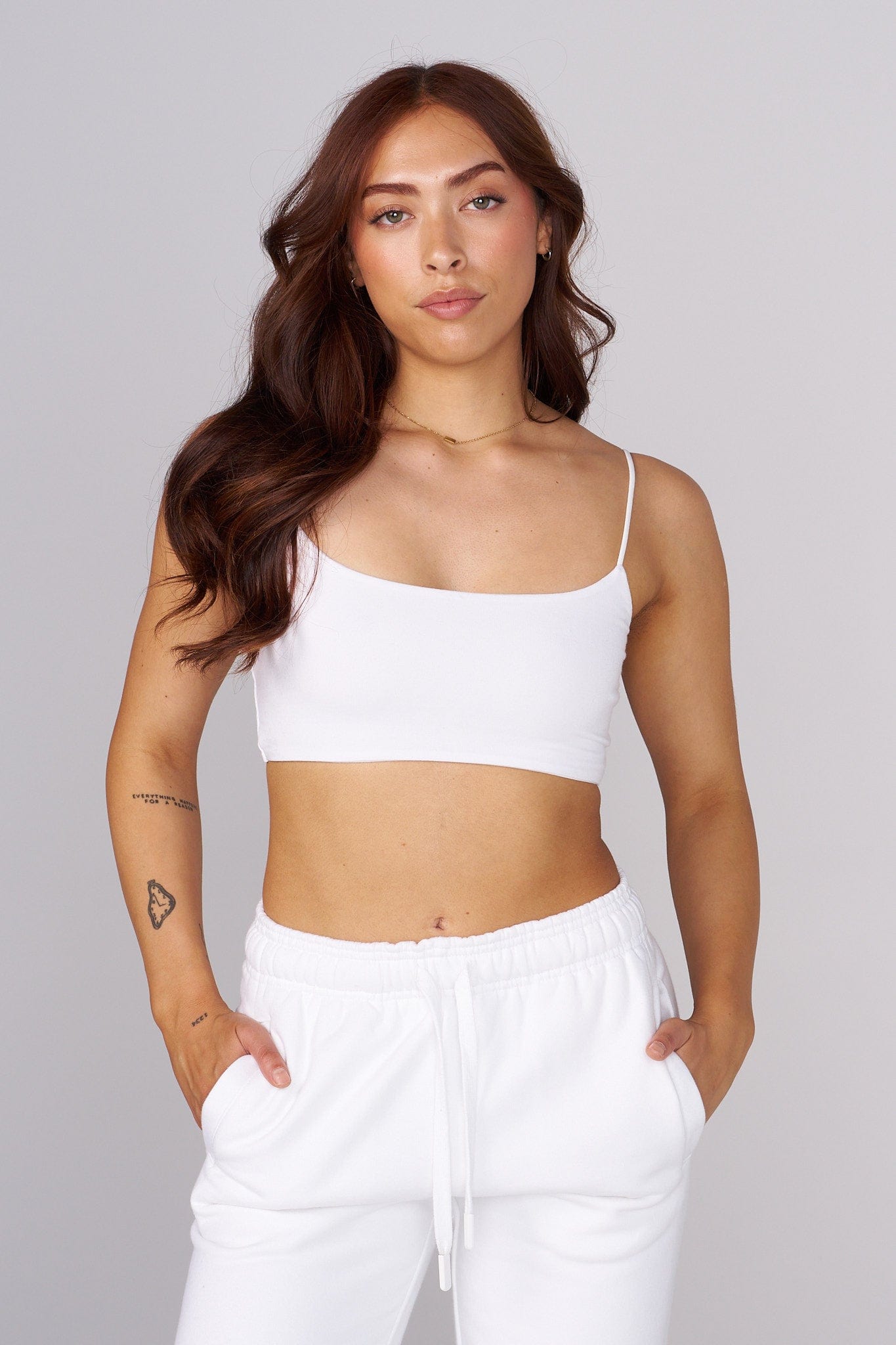 Model wearing the Iris cropped tank top in natural sunlight