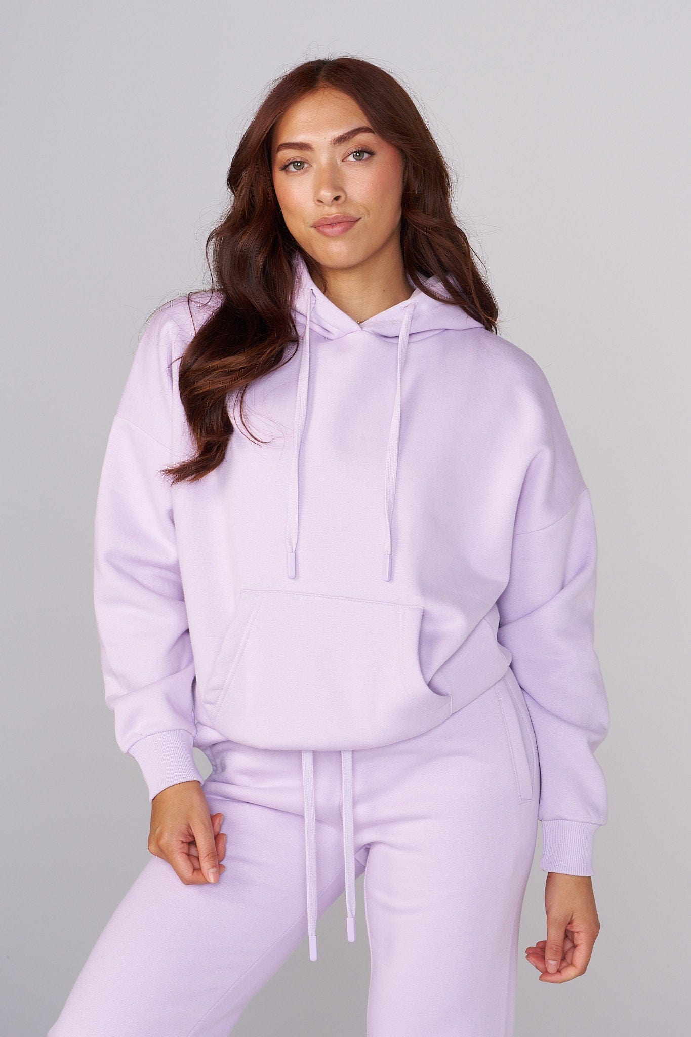 Model wearing the oversized zip up hoodie in a casual setting.