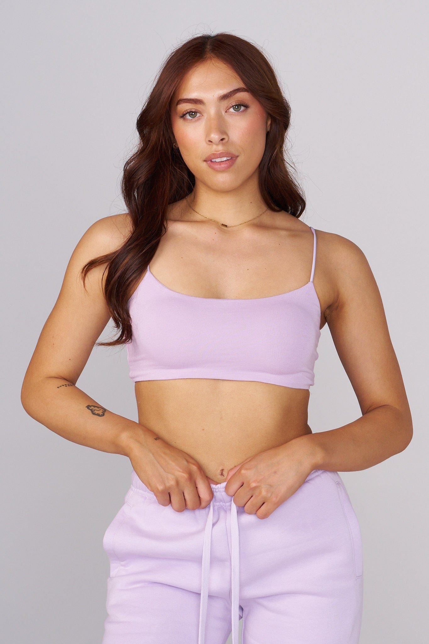 Model wearing the Iris cropped tank top in natural sunlight