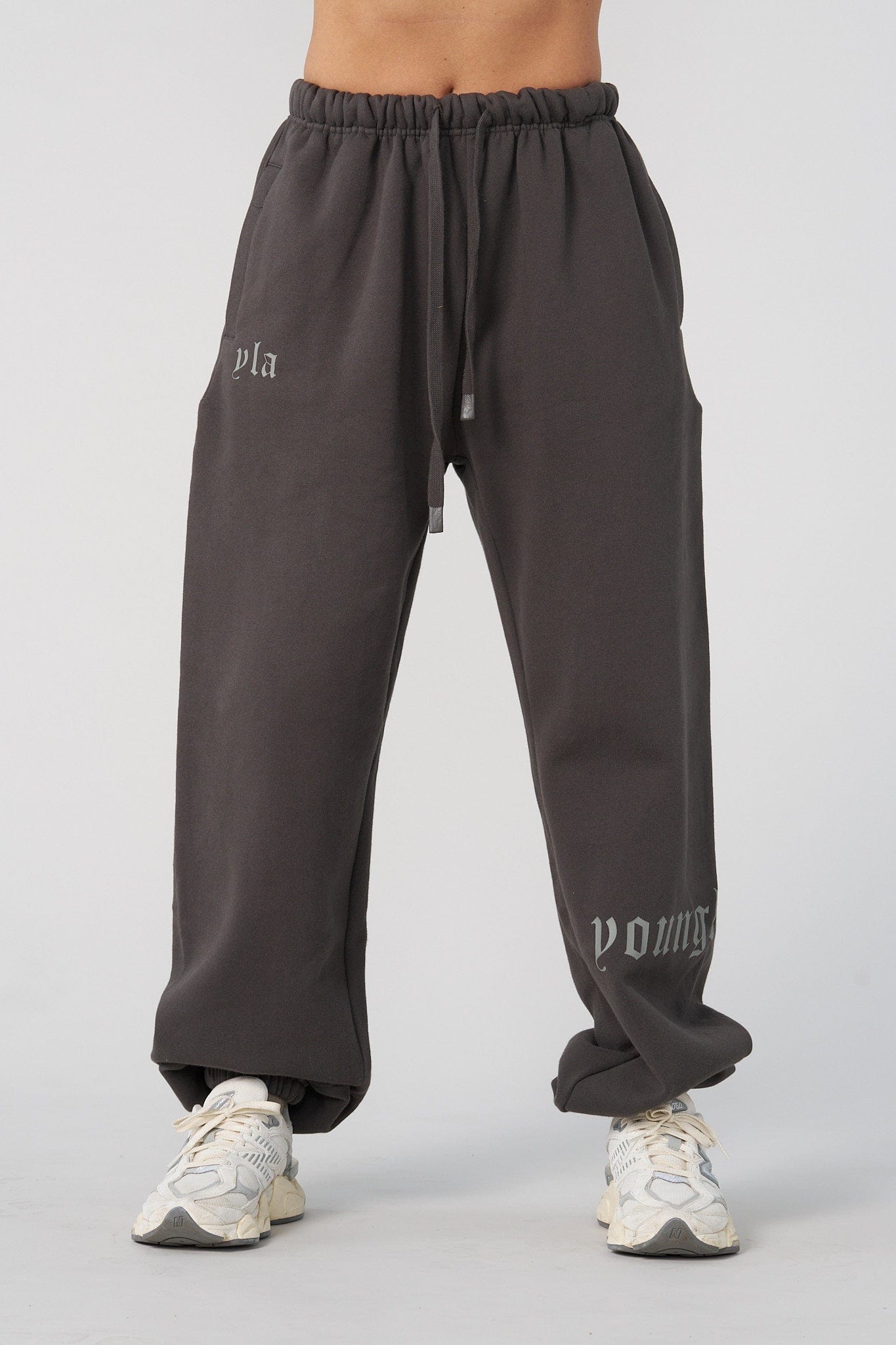 Side view of mens joggers showing the branding on the lower leg