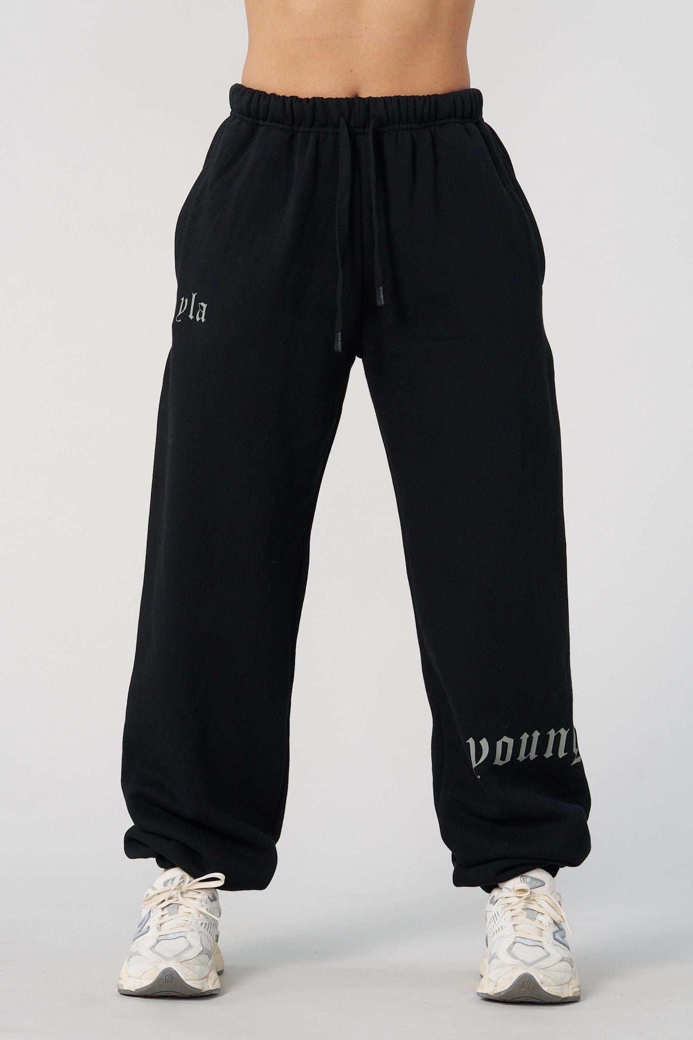 Side view of mens joggers showing the branding on the lower leg