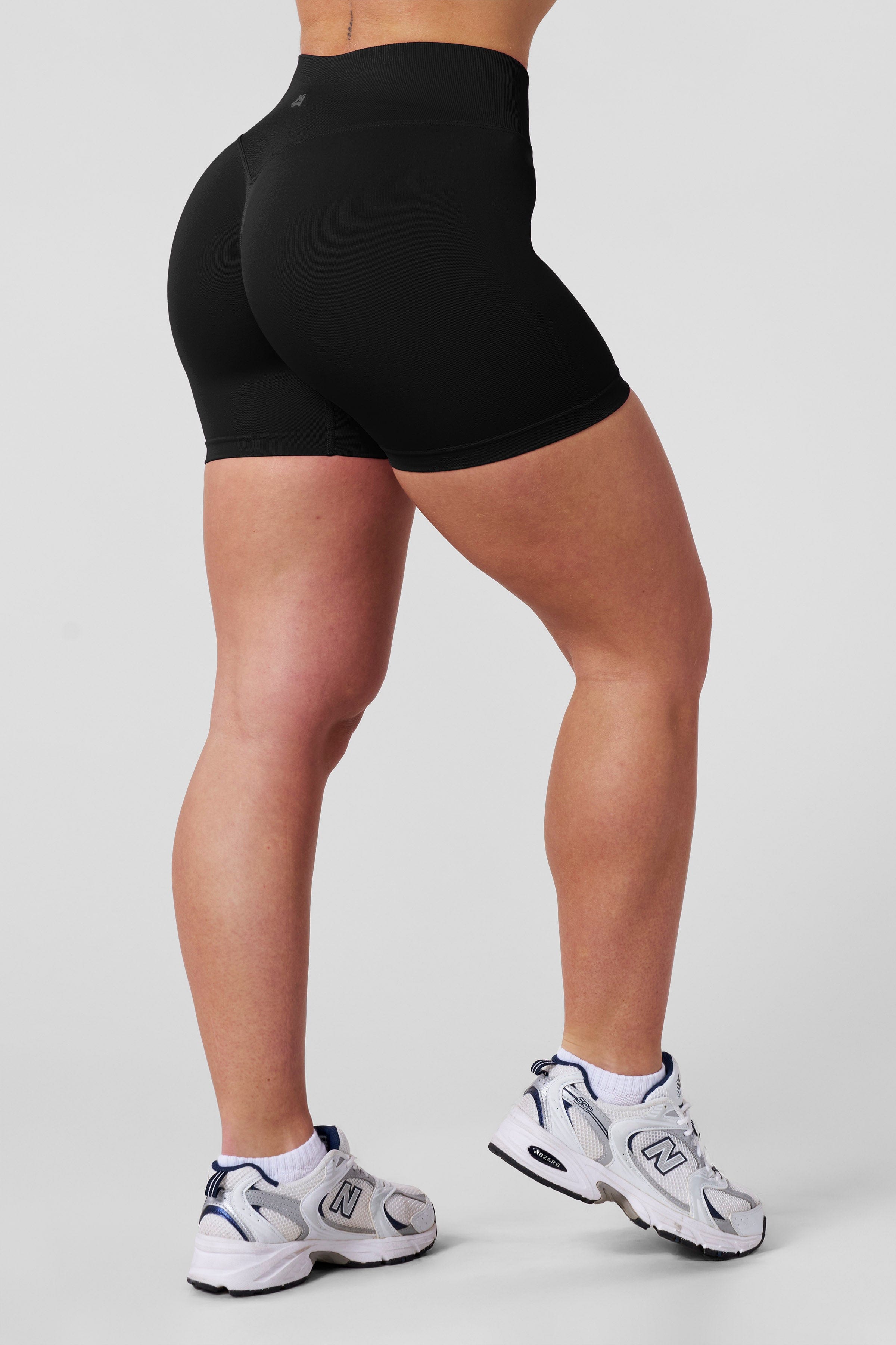 Back angle showing contour-knit fit for daily activewear use.