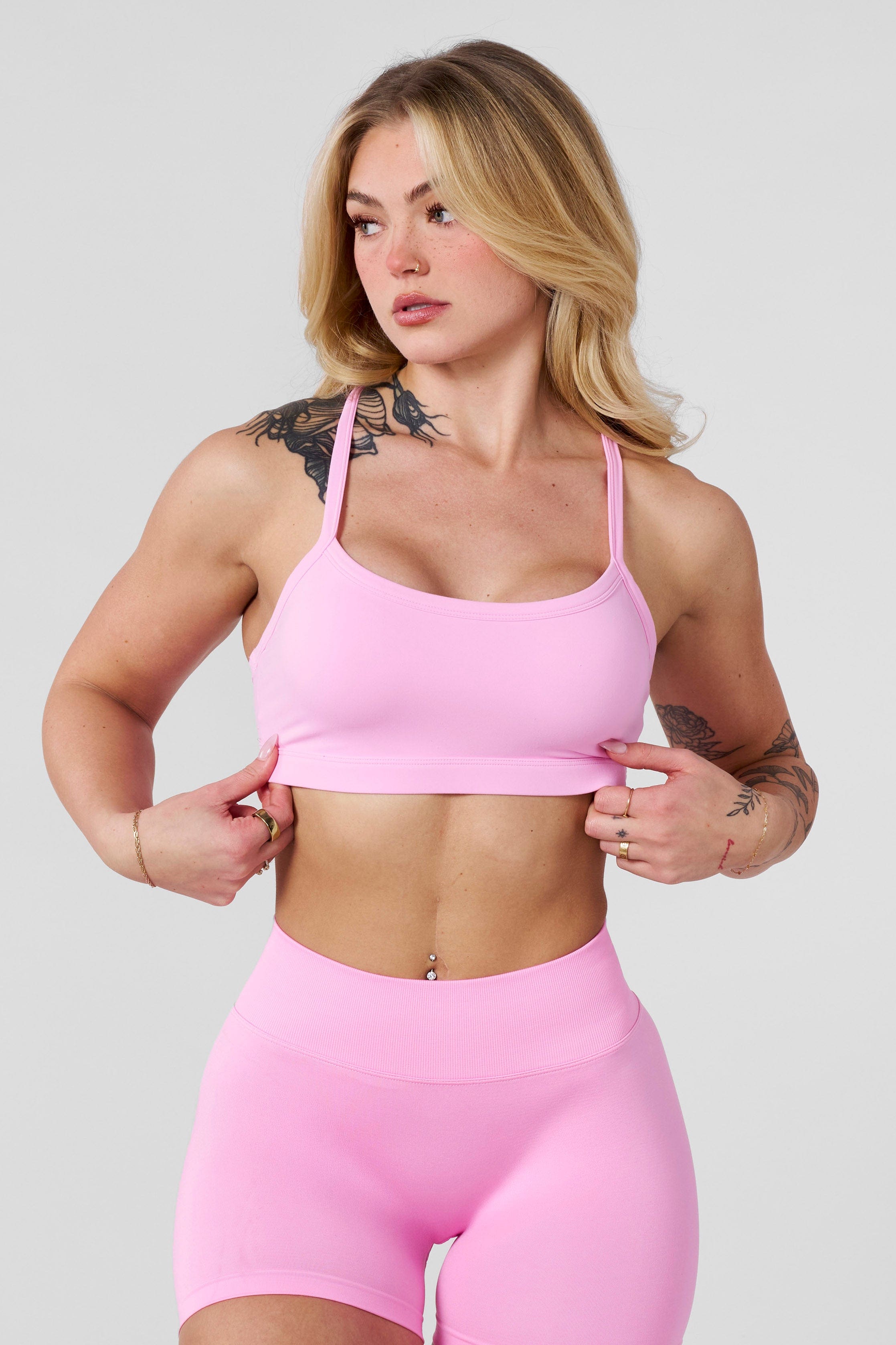 Front view of model wearing medium-support lululemon sports bra on outdoor trail