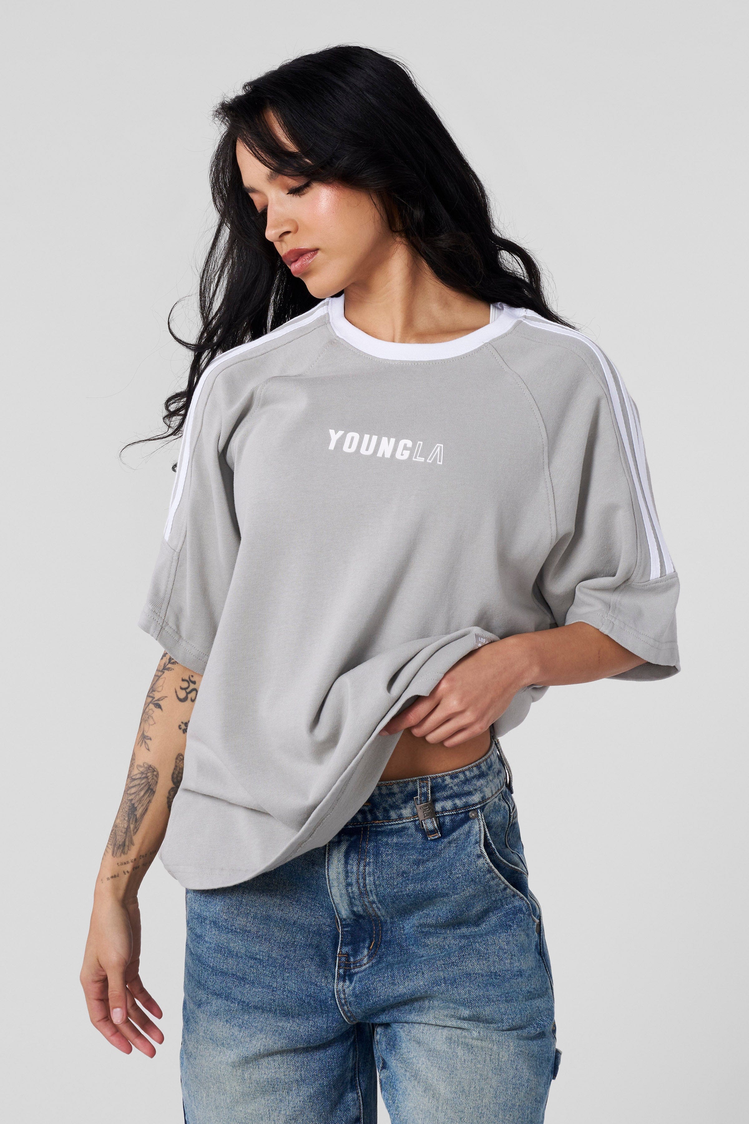 Casual street-style outfit featuring this oversized t-shirt with jeans