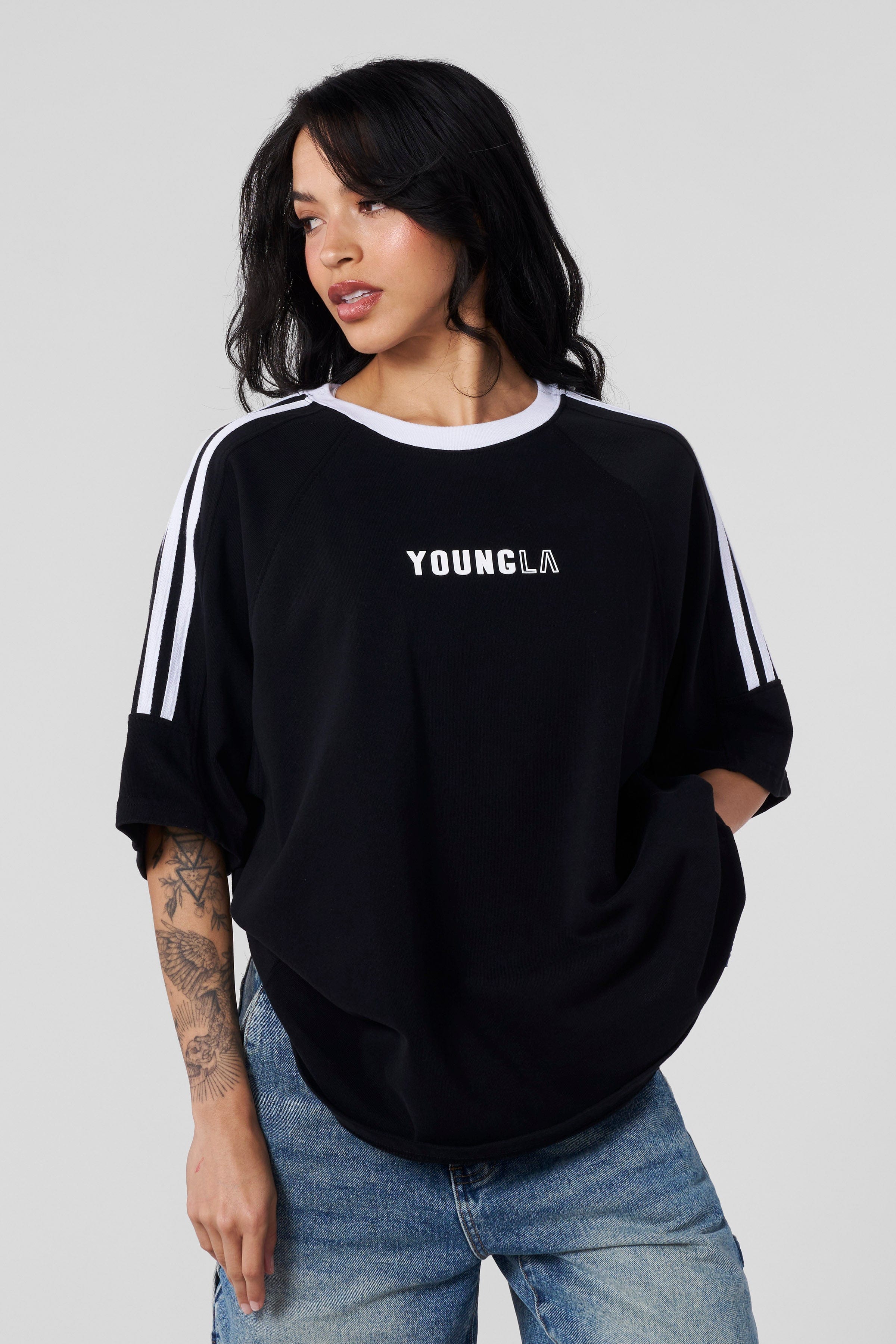 Casual street-style outfit featuring this oversized t-shirt with jeans