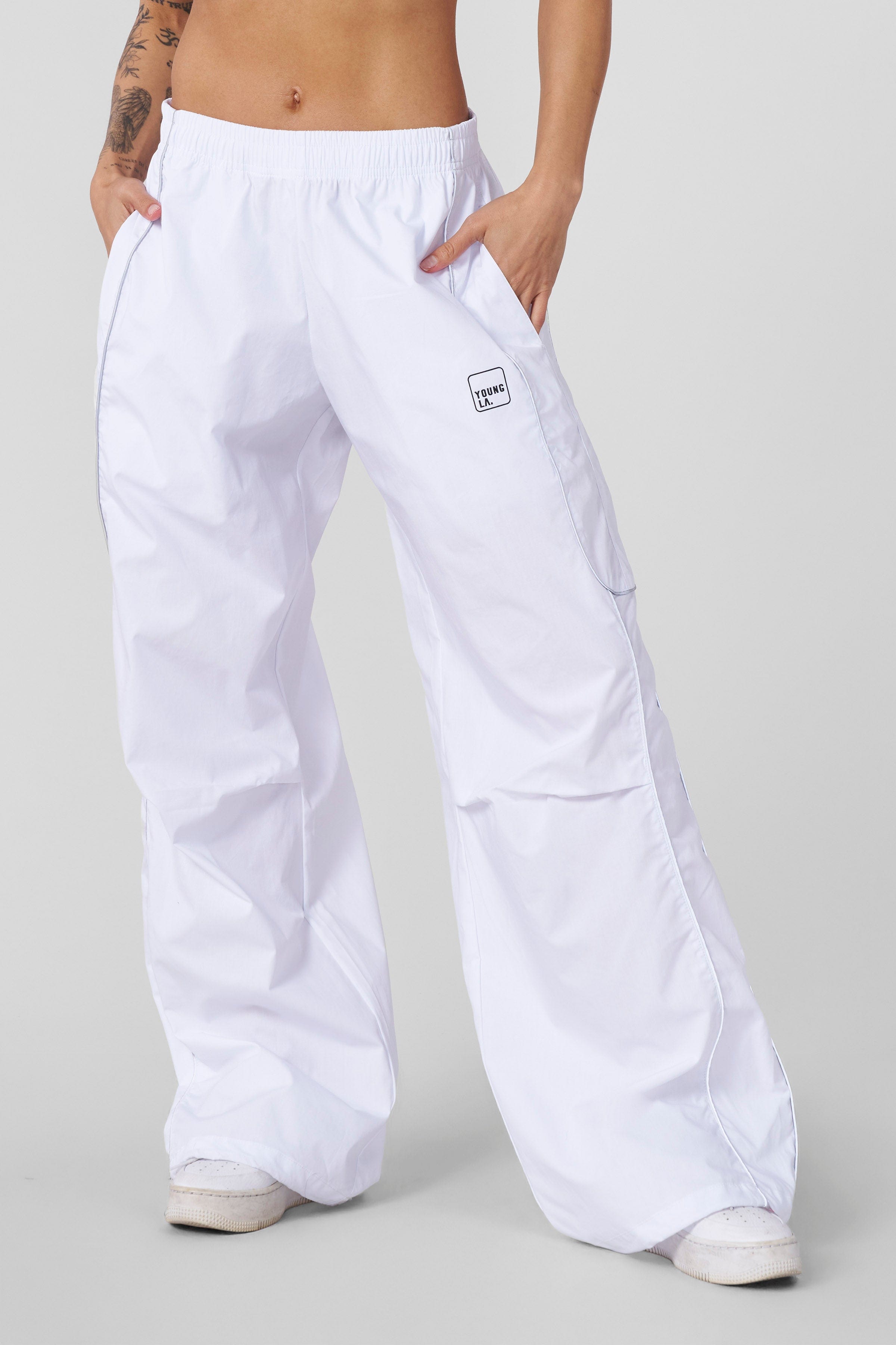 Front view of baggy track pants with adjustable hem for a relaxed fit