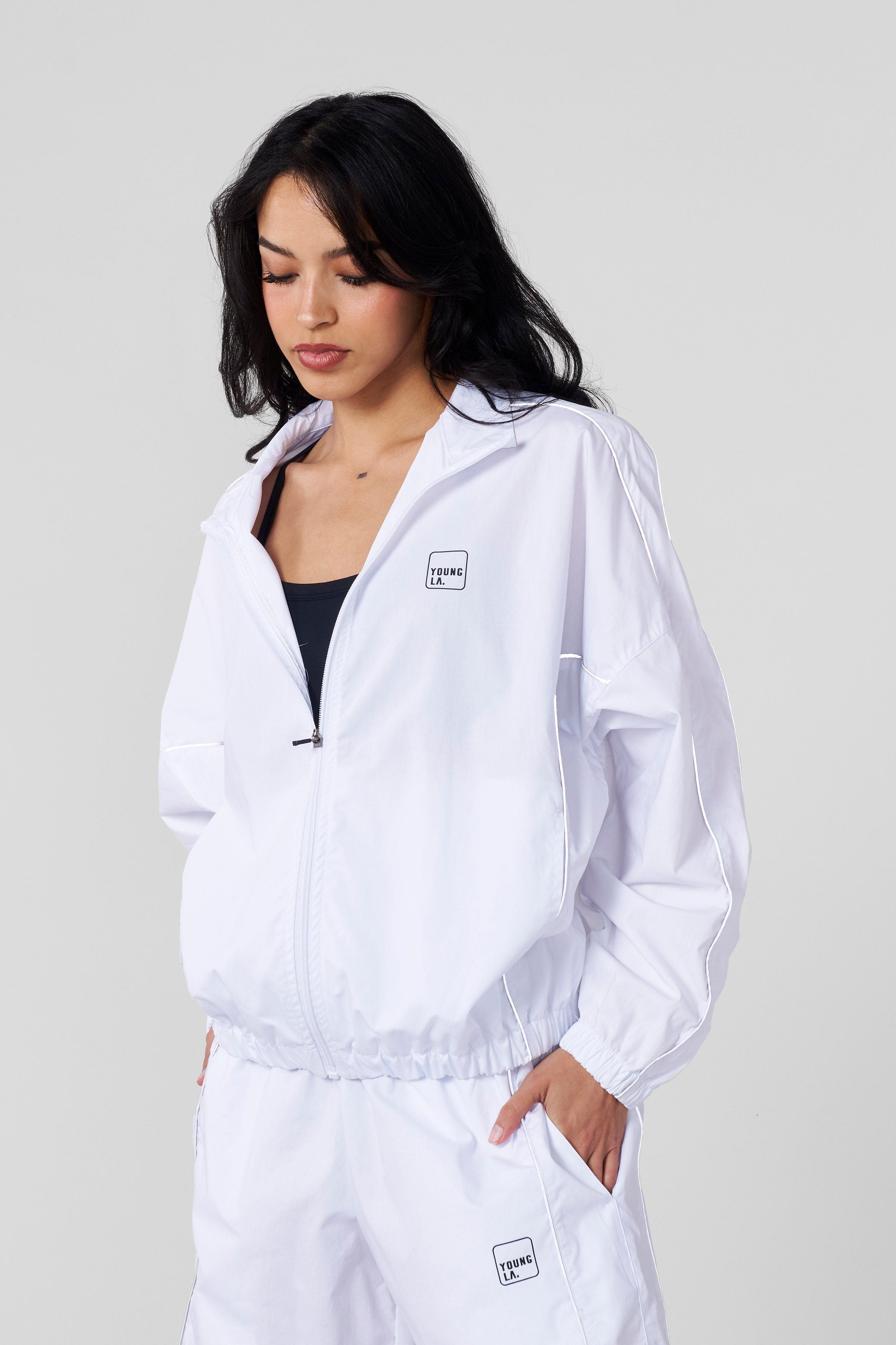 Back view of the Flash Womens Windbreaker Jacket with reflective accents.
