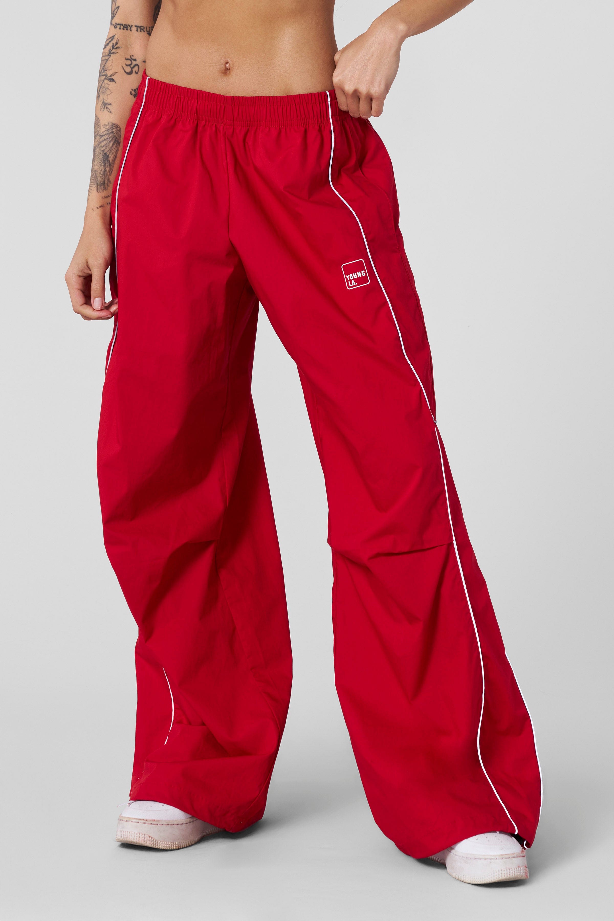 Side view of cotton track pants for women with reflective details for evening walks