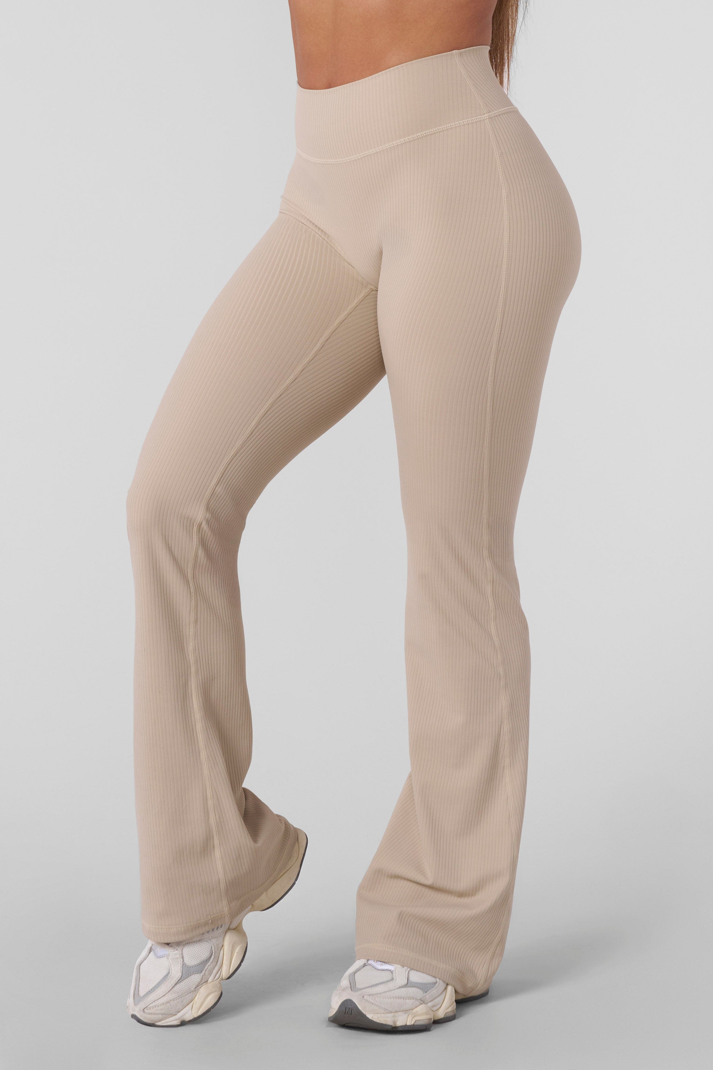 Front angle showing buttery-soft grey flare leggings paired with womens activewear top