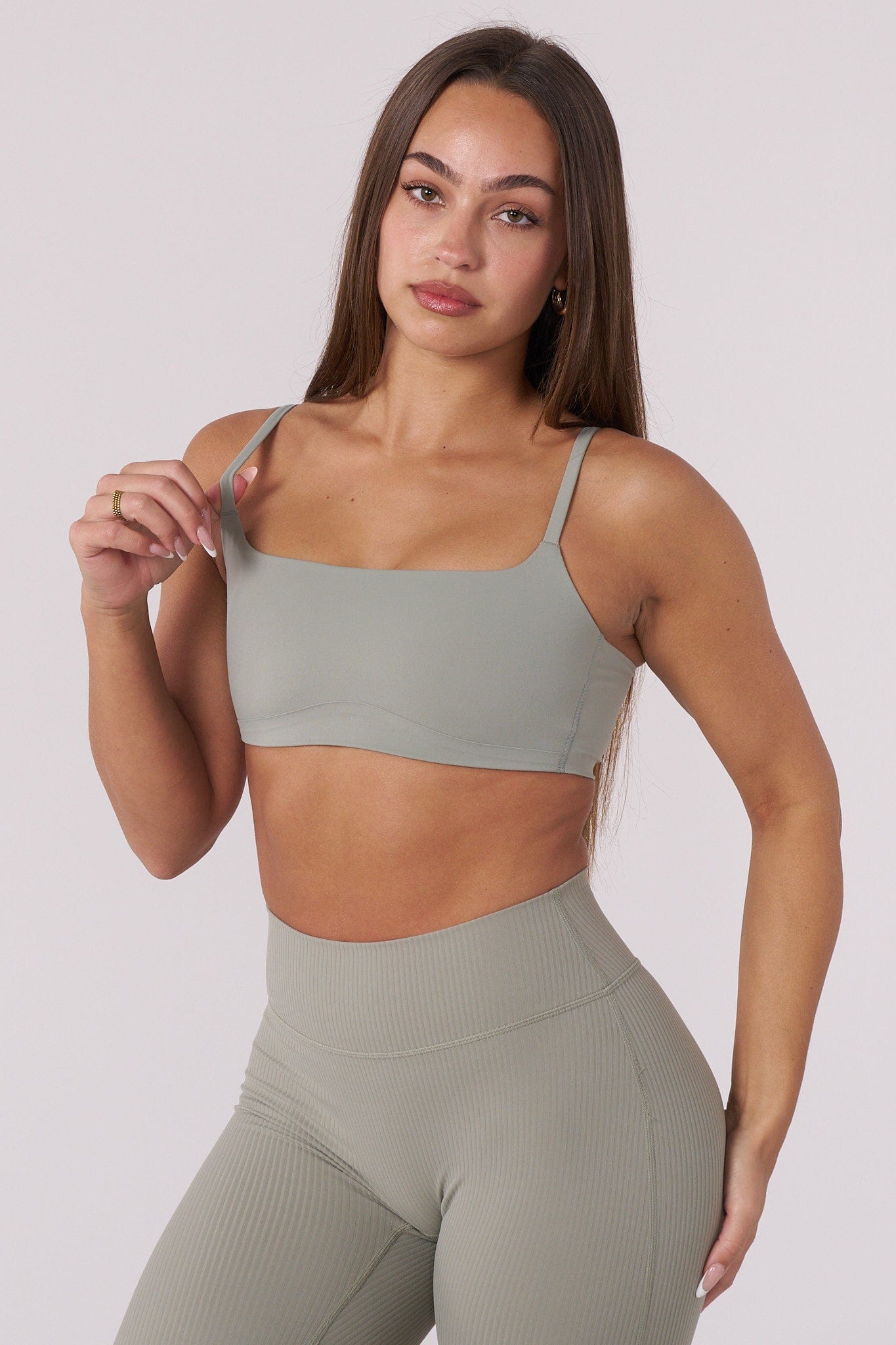 Side angle of the Luna sports bra demonstrating stretch fabric and supportive fit