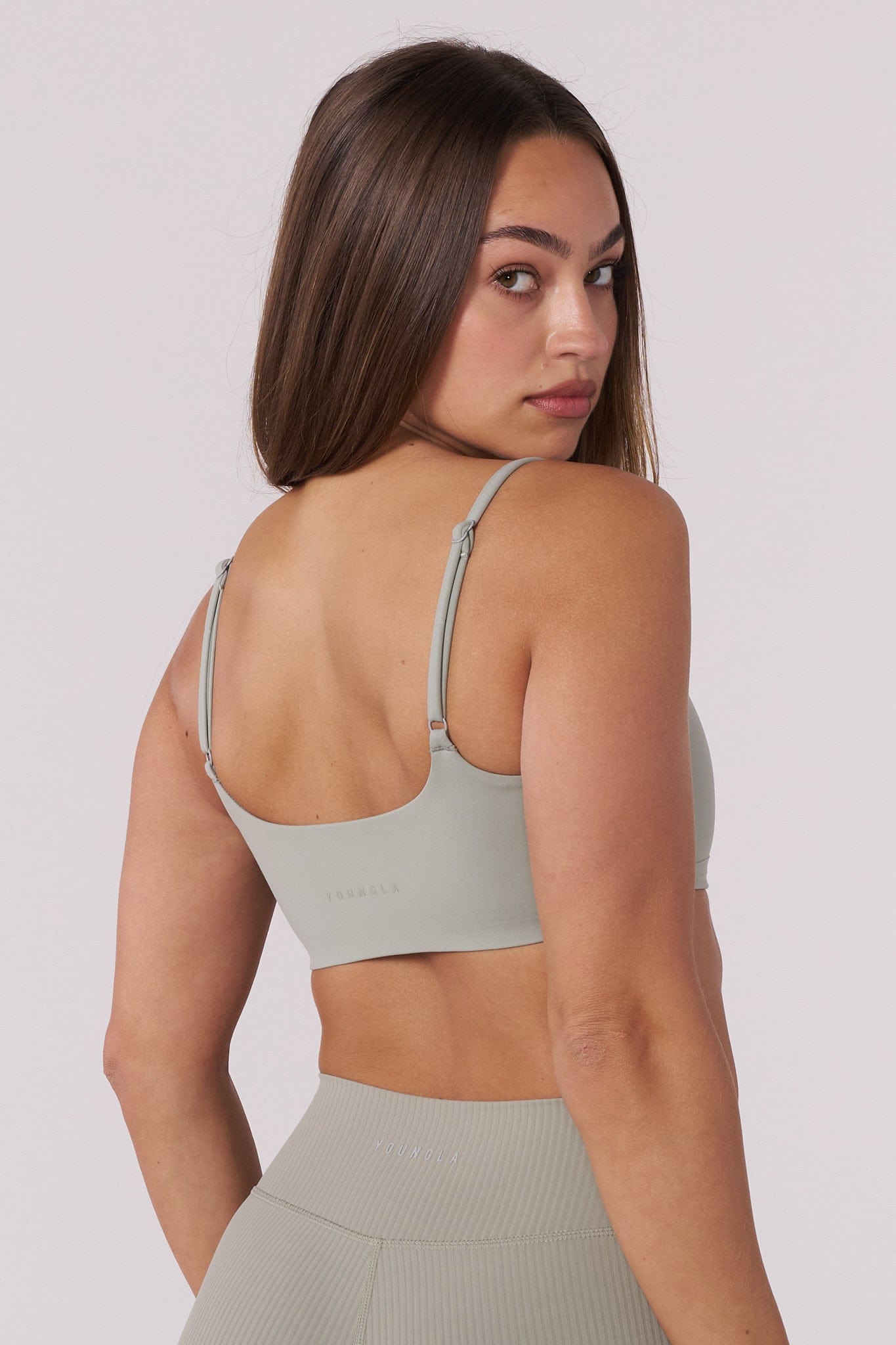 Side angle of the Luna sports bra demonstrating stretch fabric and supportive fit