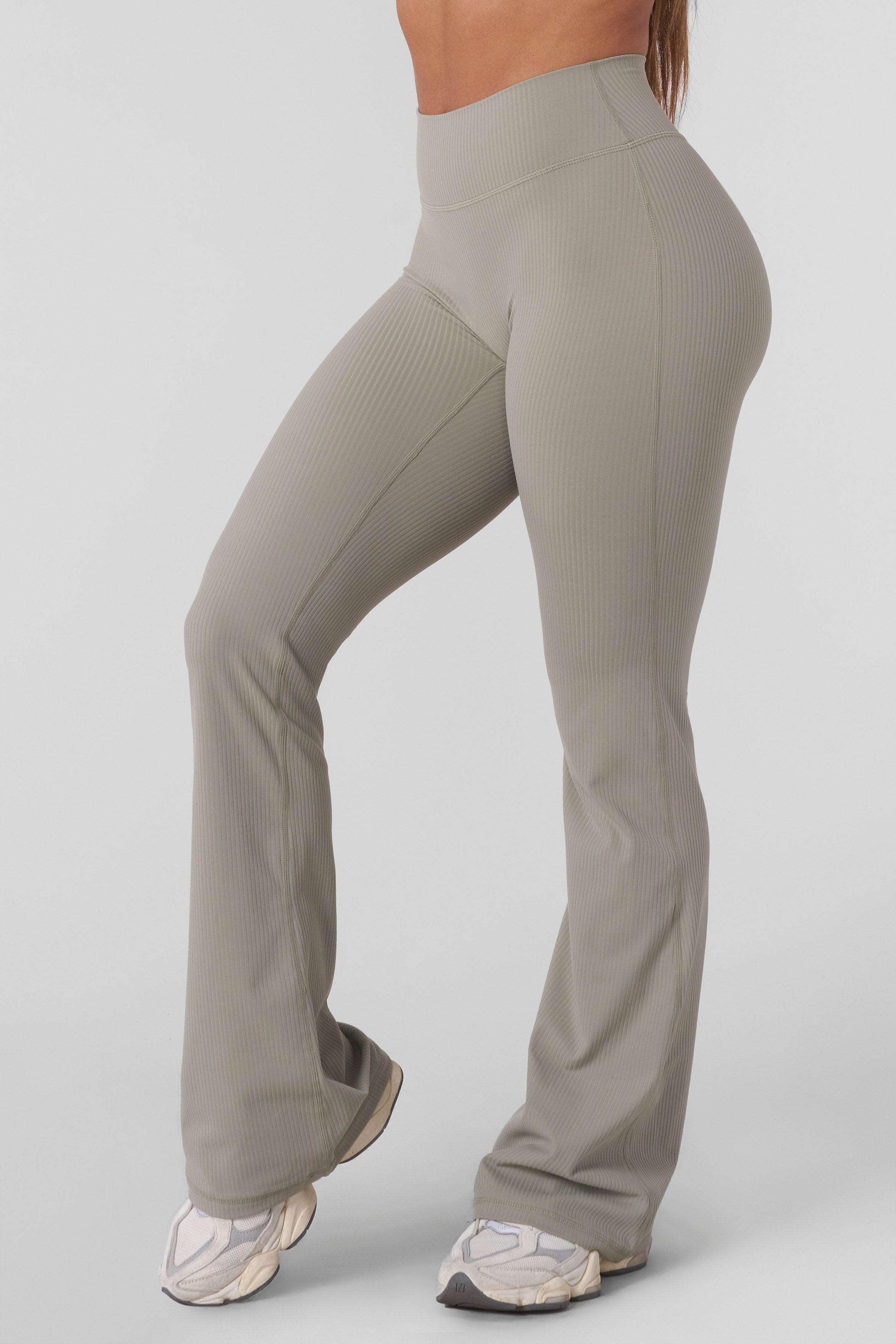 Back view highlighting high-waisted leggings with smooth sculpted fit