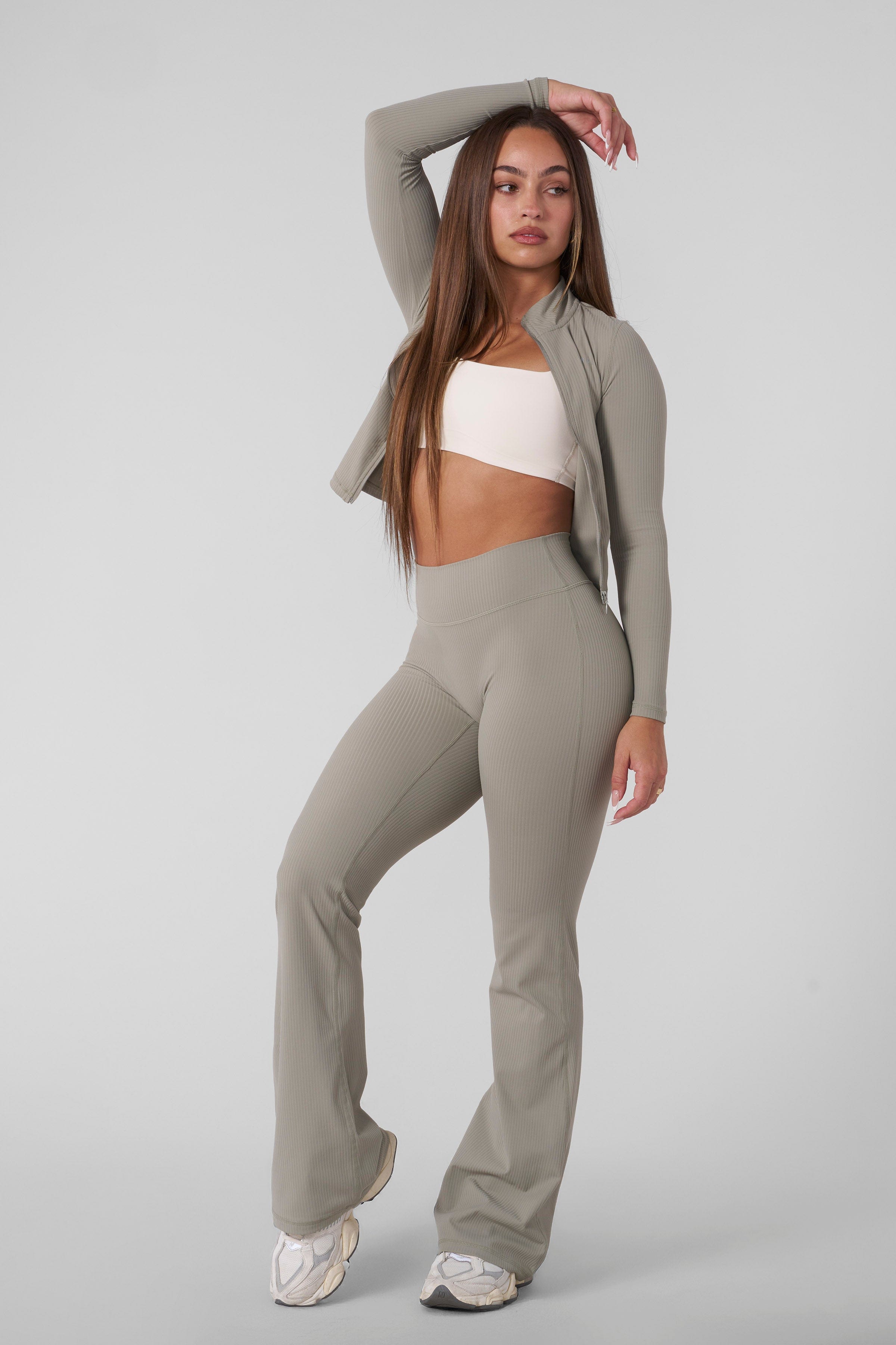 Back view highlighting high-waisted leggings with smooth sculpted fit