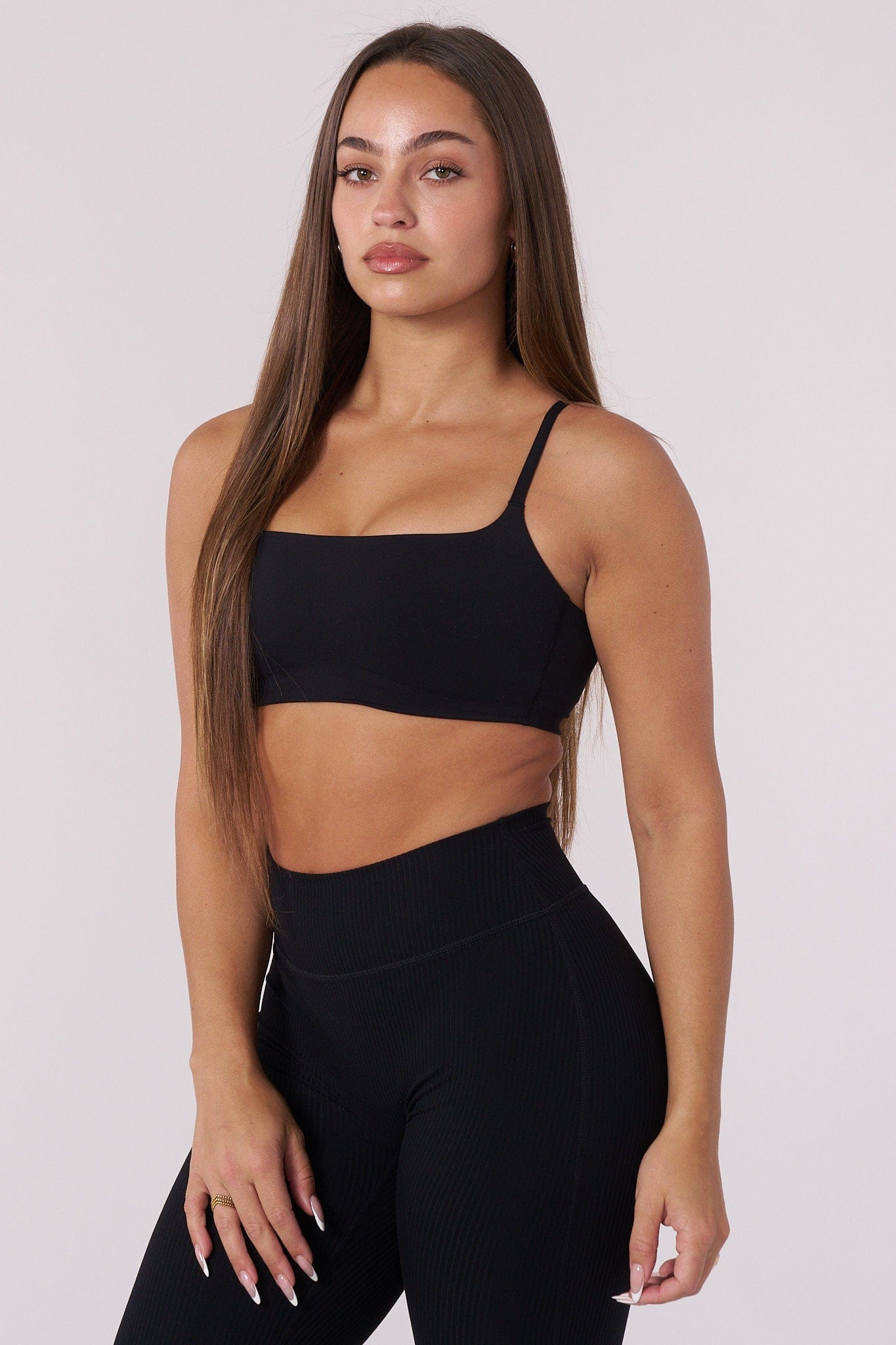 Model wearing the Luna sports bra during a workout in a gym setting