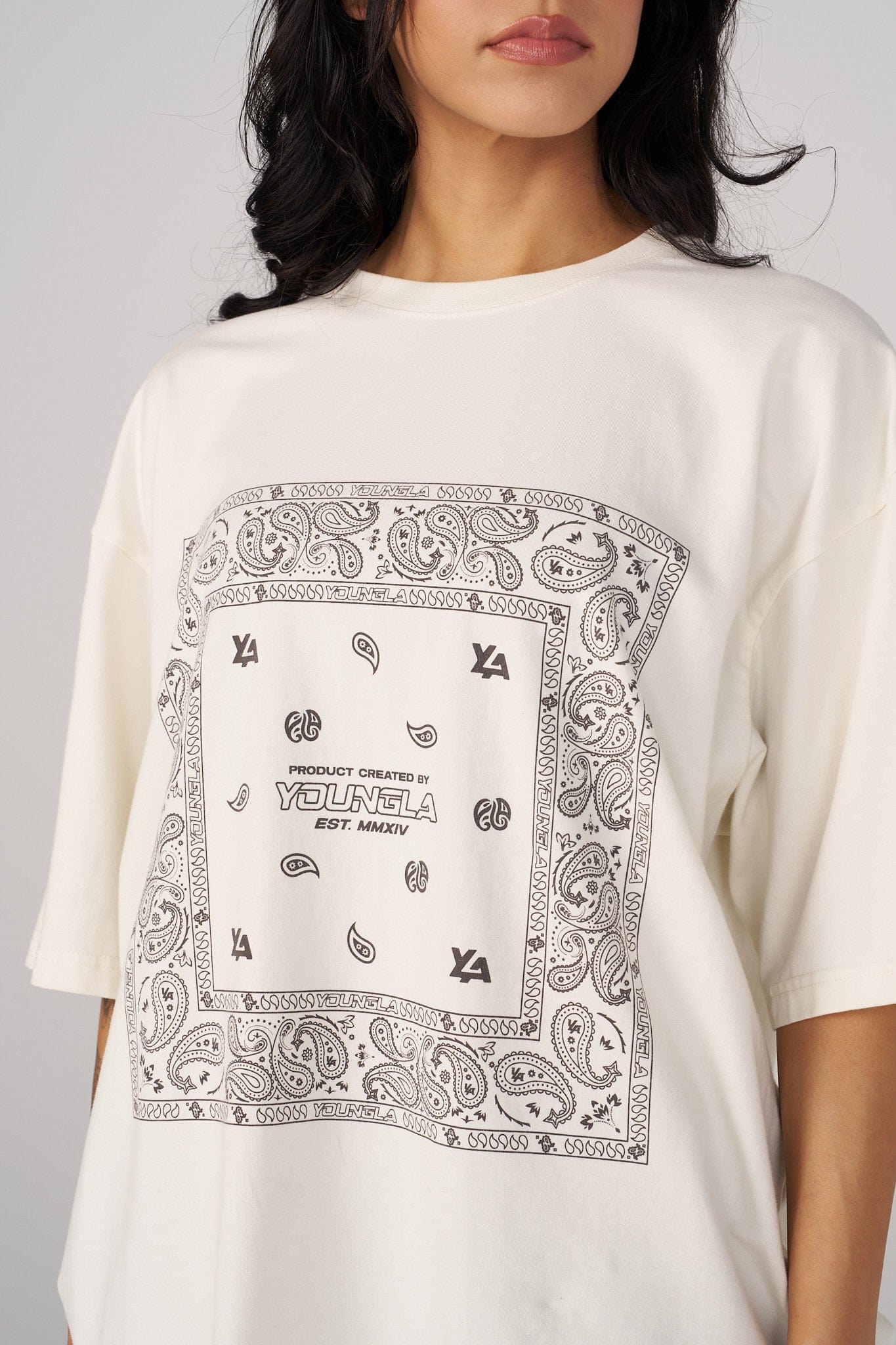 Side view showcasing the relaxed fit of the oversized t-shirt.