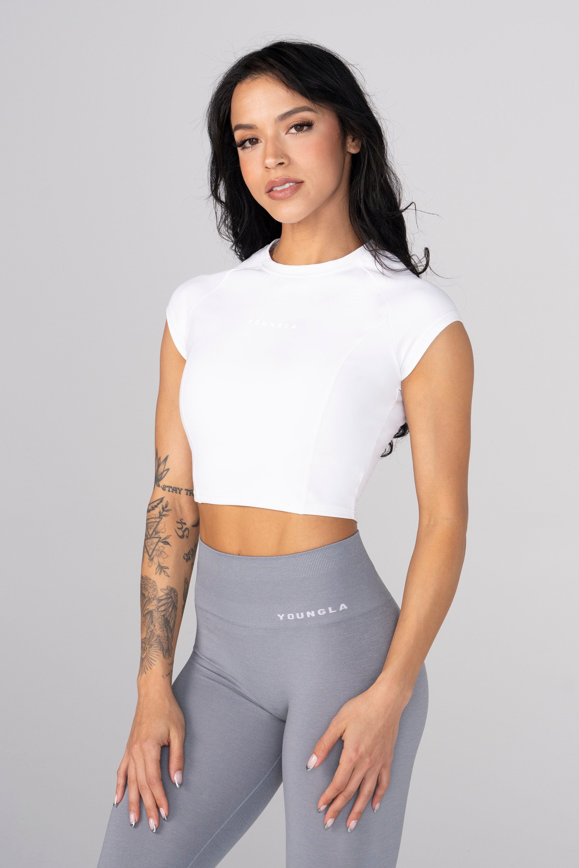 Front view of Elevate Compression Crop Top in action during a workout.
