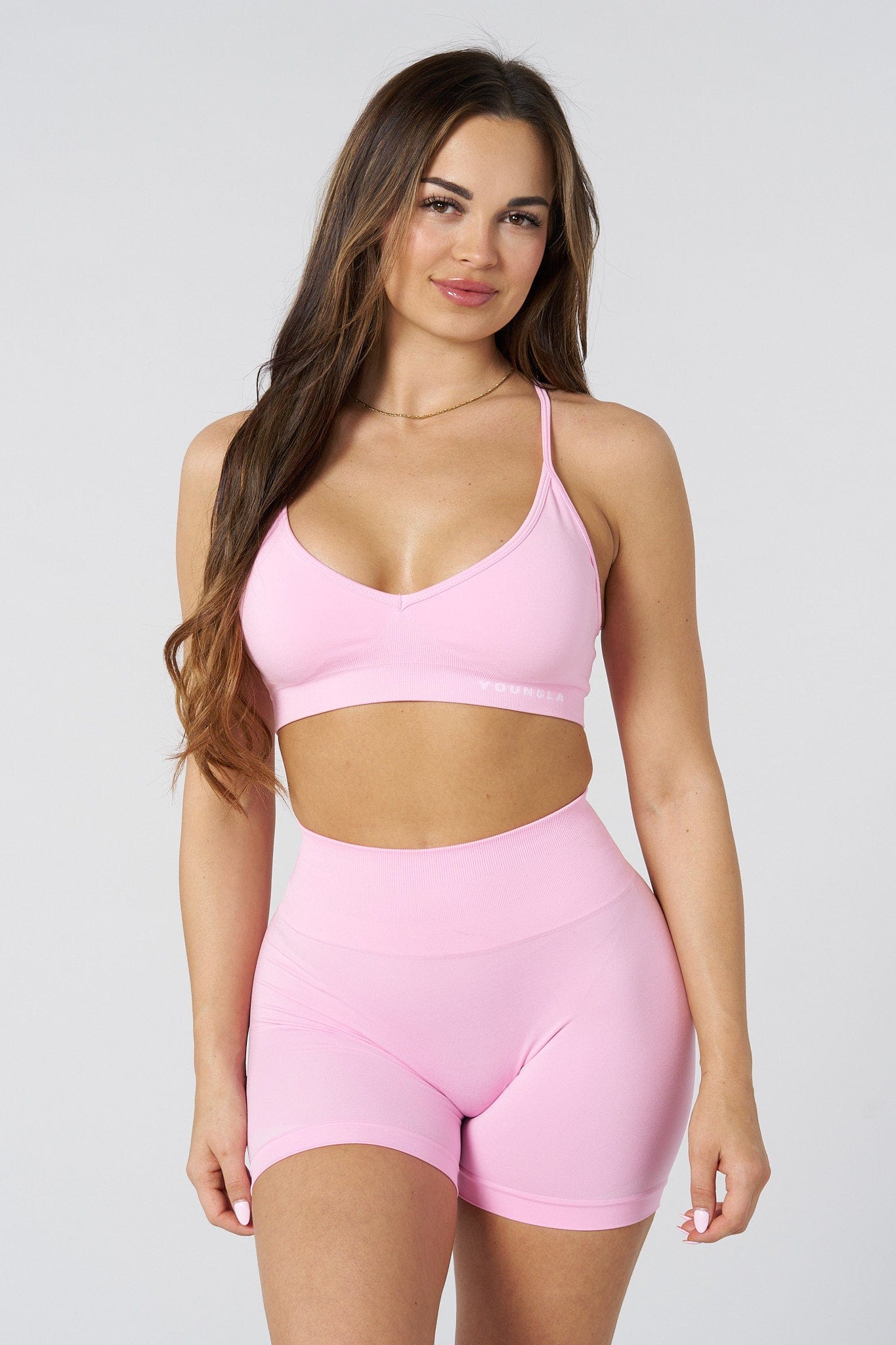 Sports bra flat-lay showing CoreFlex design and stretch fit