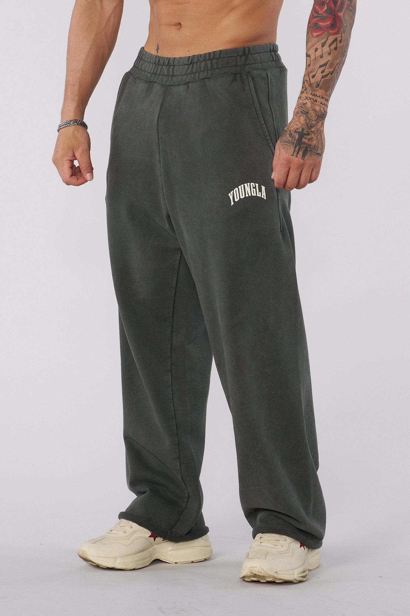 Side view of baggy sweat pants, highlighting the unique pigment-washed fabric.