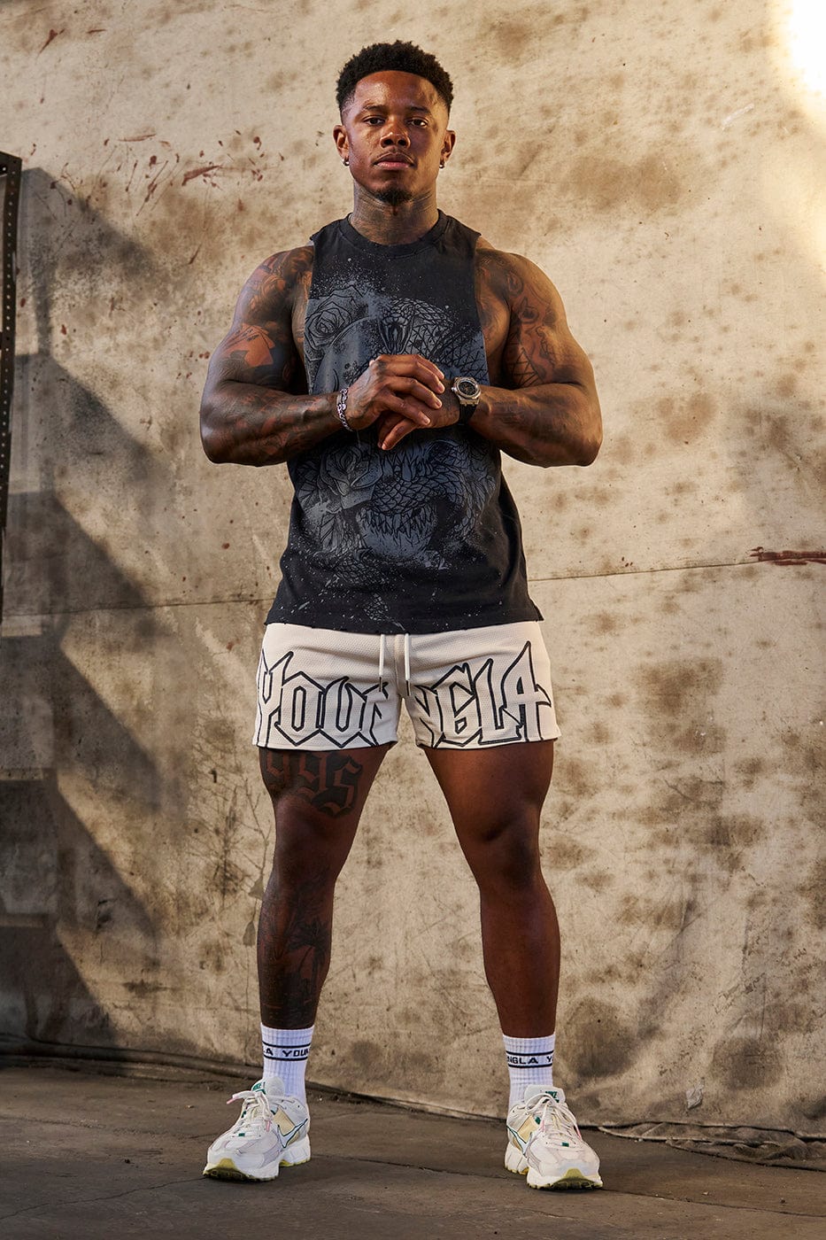 Back view of tank tops for men styled for weight training