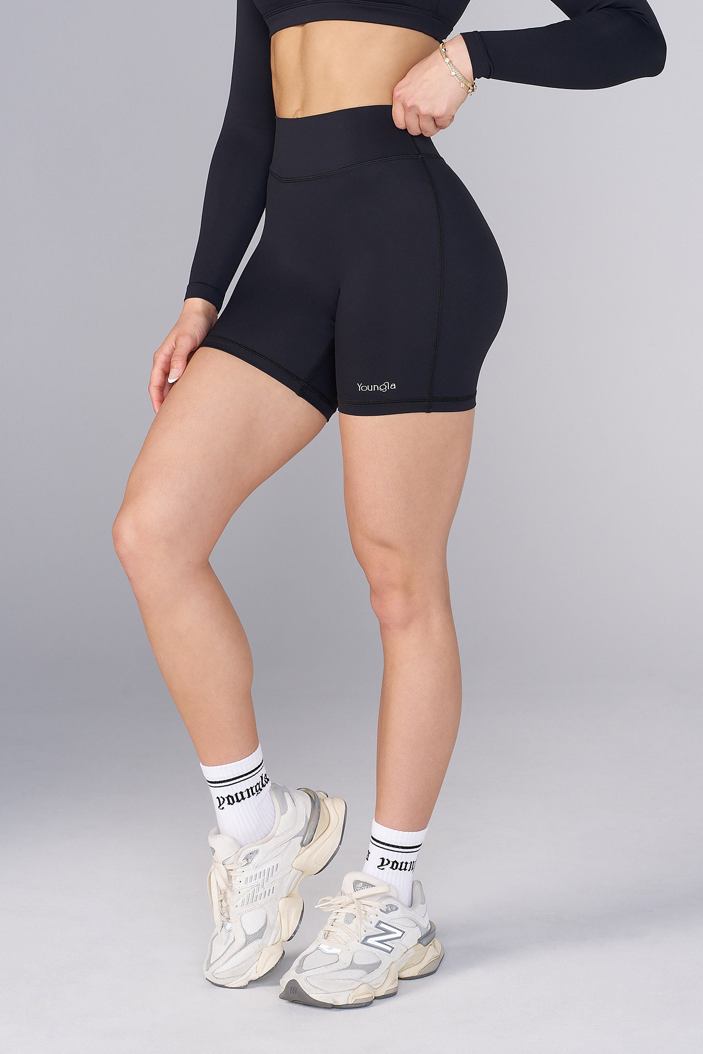 Close-up of mens yoga shorts waistband stretch and pastel fabric blend