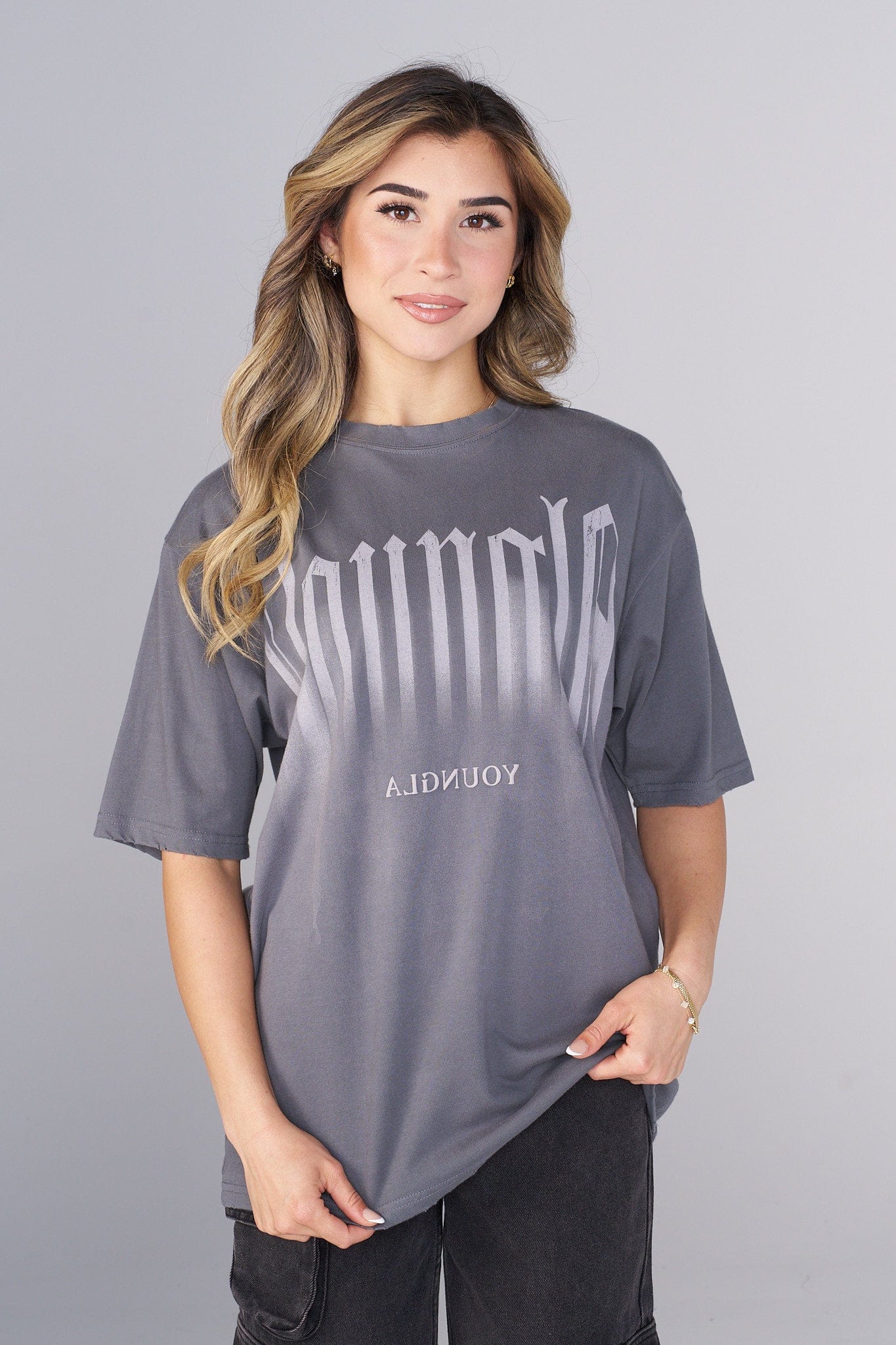 Front view of oversized smokey graphic tee with distressed edges, ideal for casual streetwear