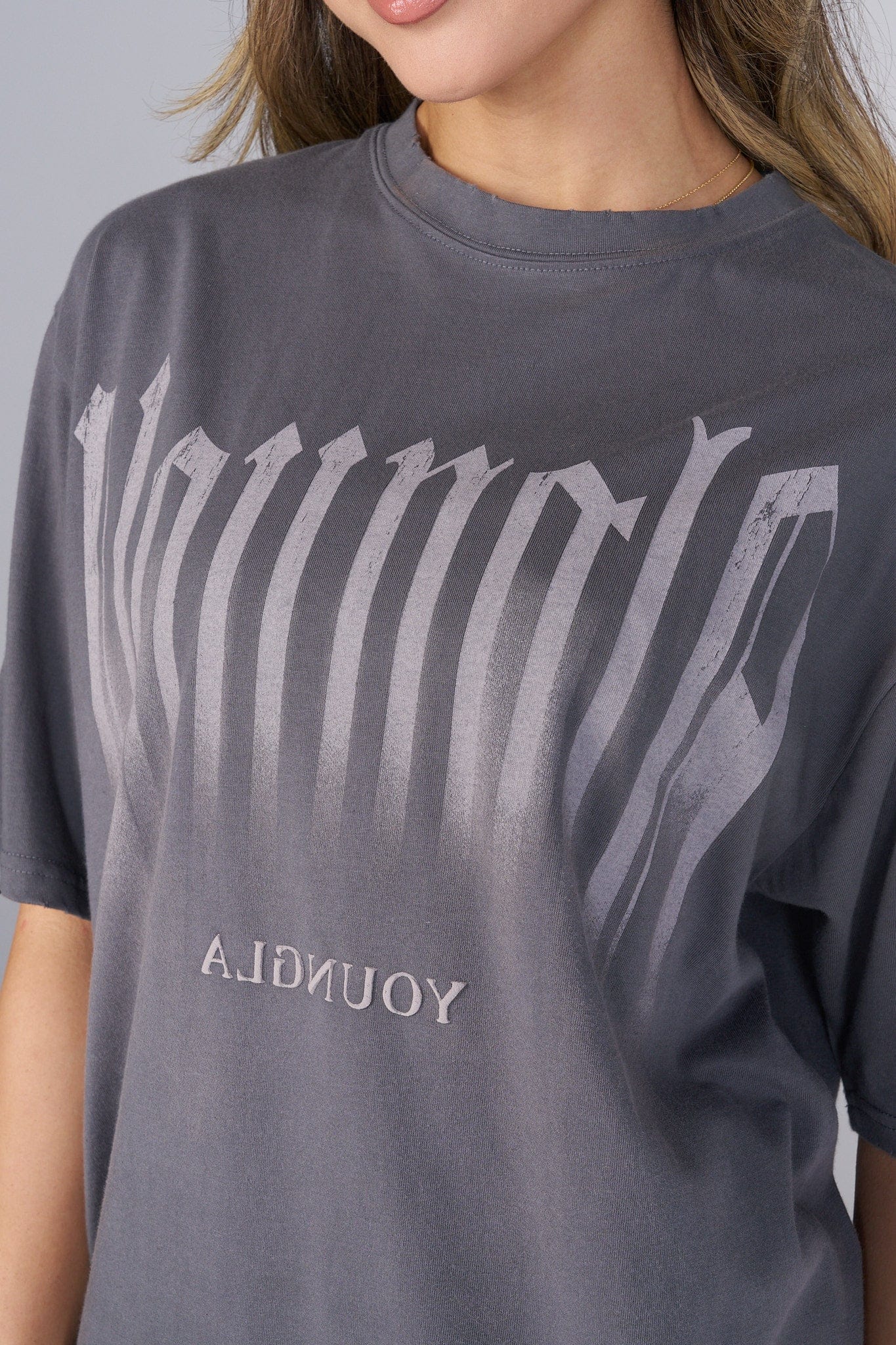 Close-up of the soft fabric and detailed smoke graphic on the oversized t shirt