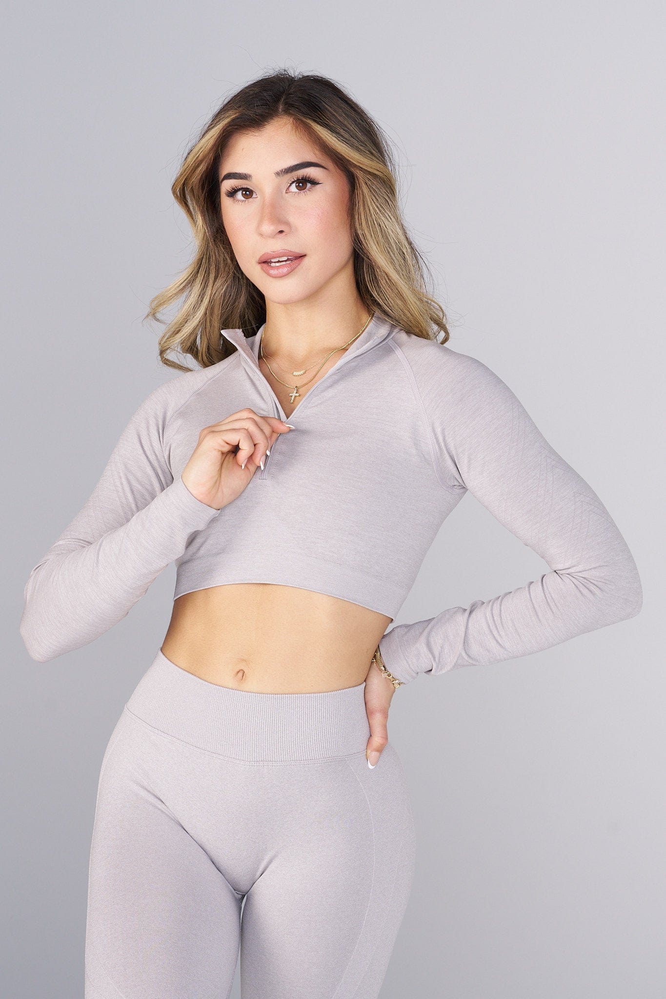 Model wearing the quarter zip sweater during a workout