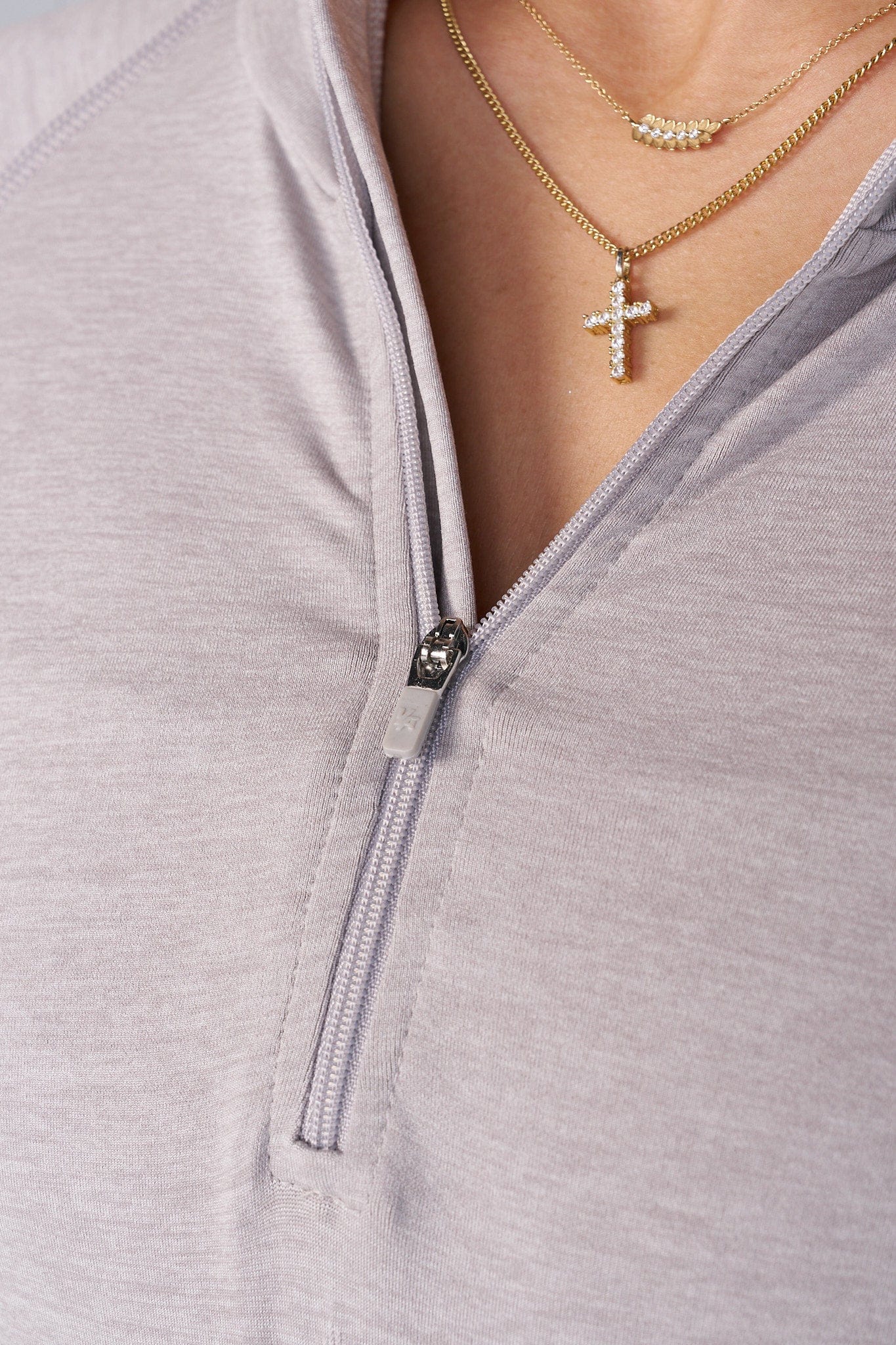 Close-up of the seamless quarter zip pullover showing fabric texture